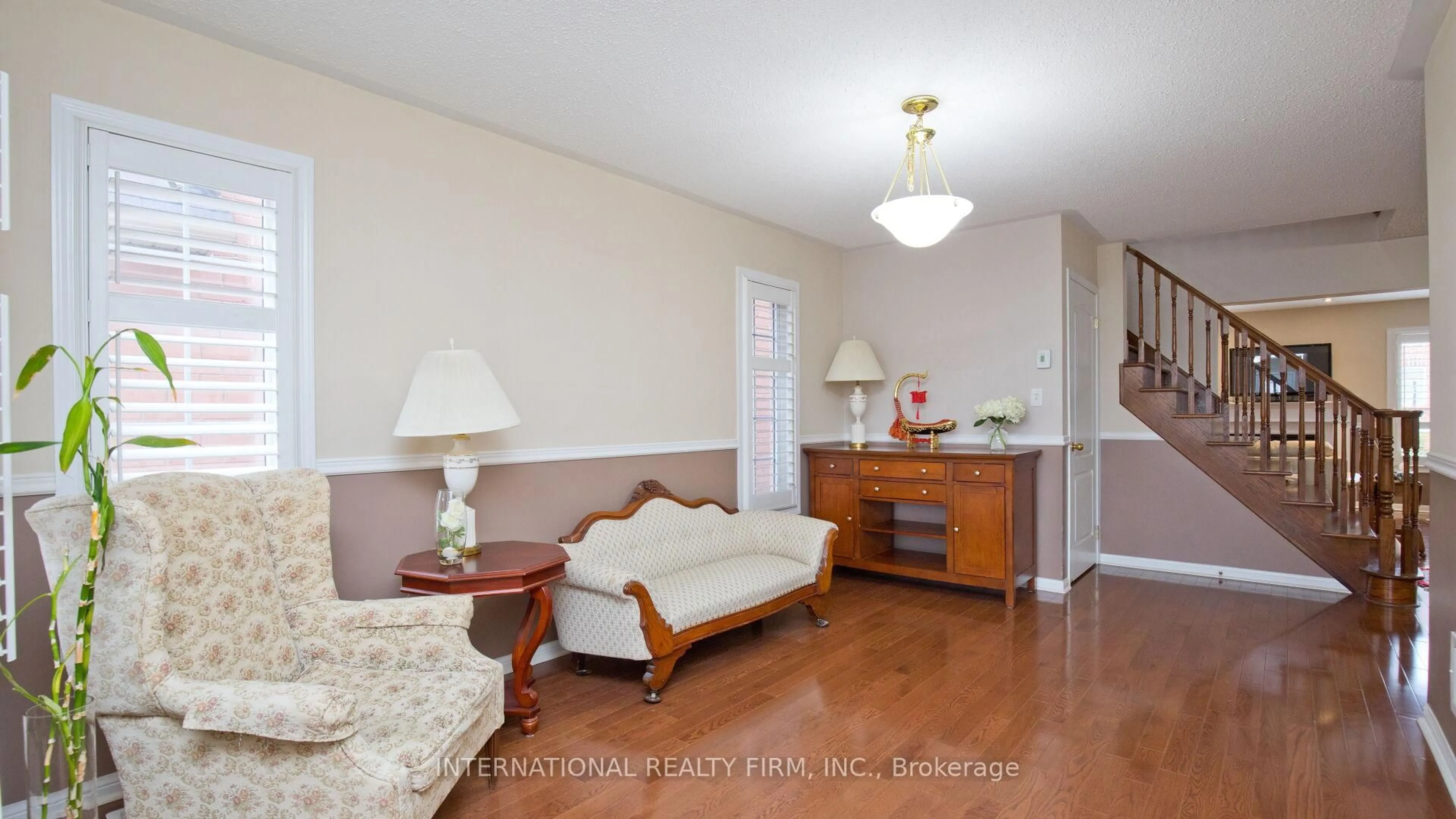 Living room with furniture, wood/laminate floor for 30 Benmore Cres, Brampton Ontario L6P 2T3