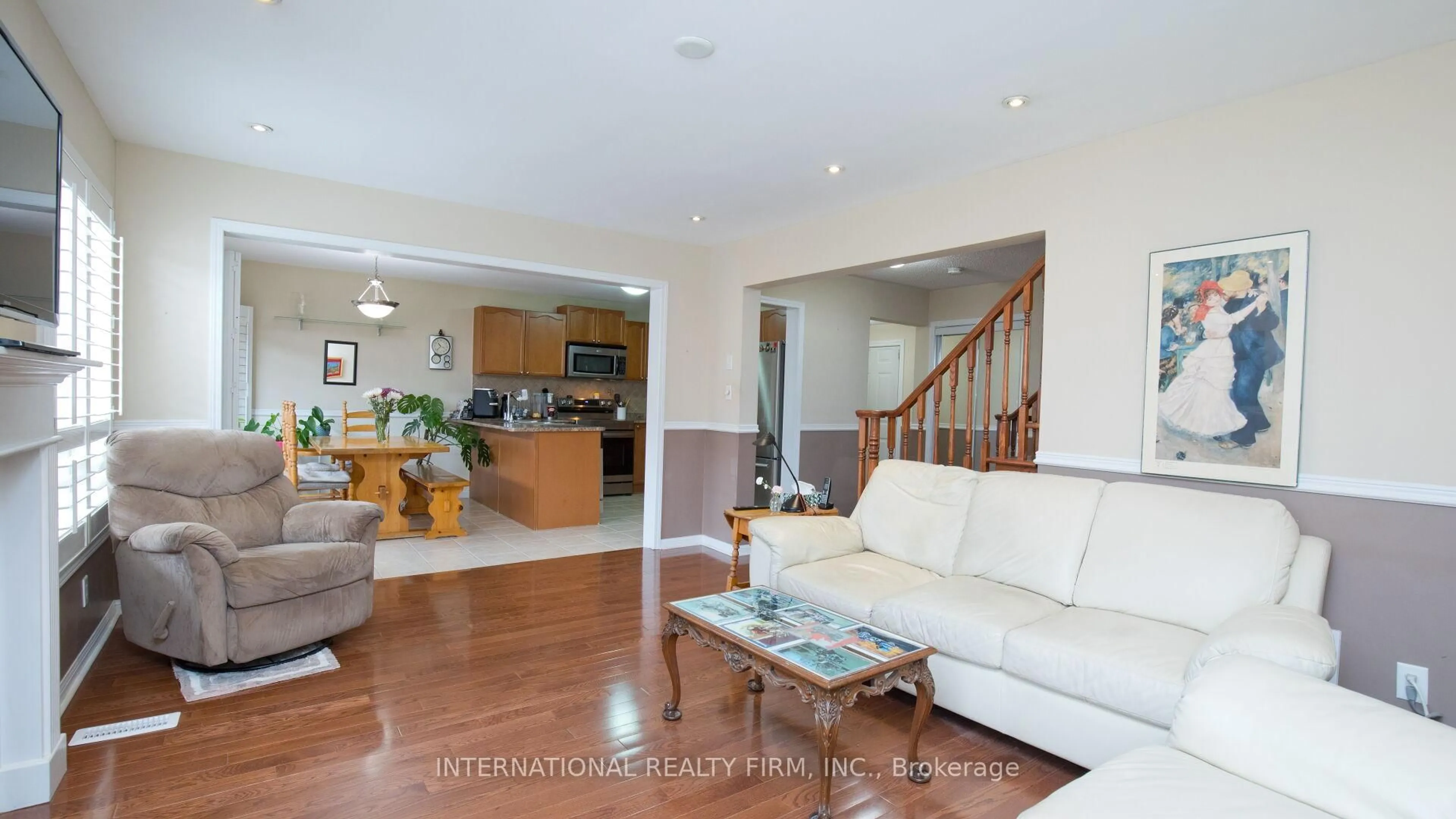 Living room with furniture, wood/laminate floor for 30 Benmore Cres, Brampton Ontario L6P 2T3