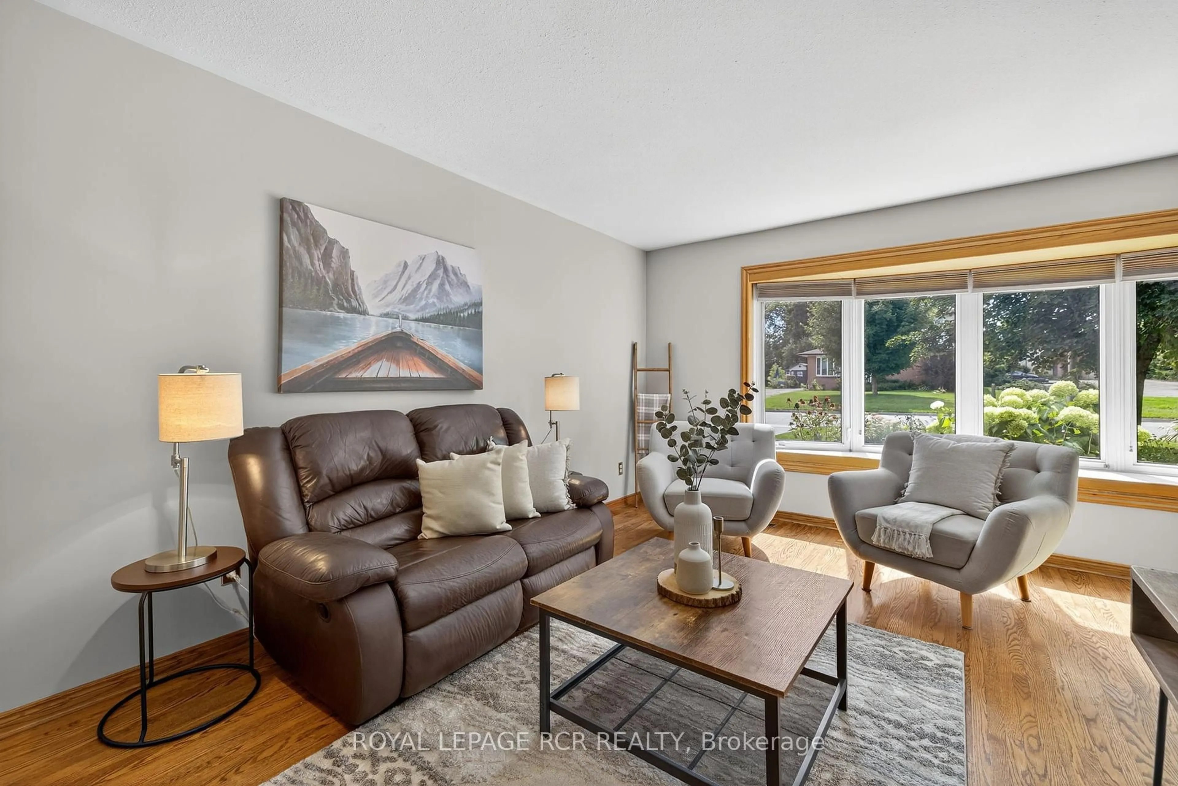 Living room with furniture, wood/laminate floor for 217 Zina St, Orangeville Ontario L9W 1E9