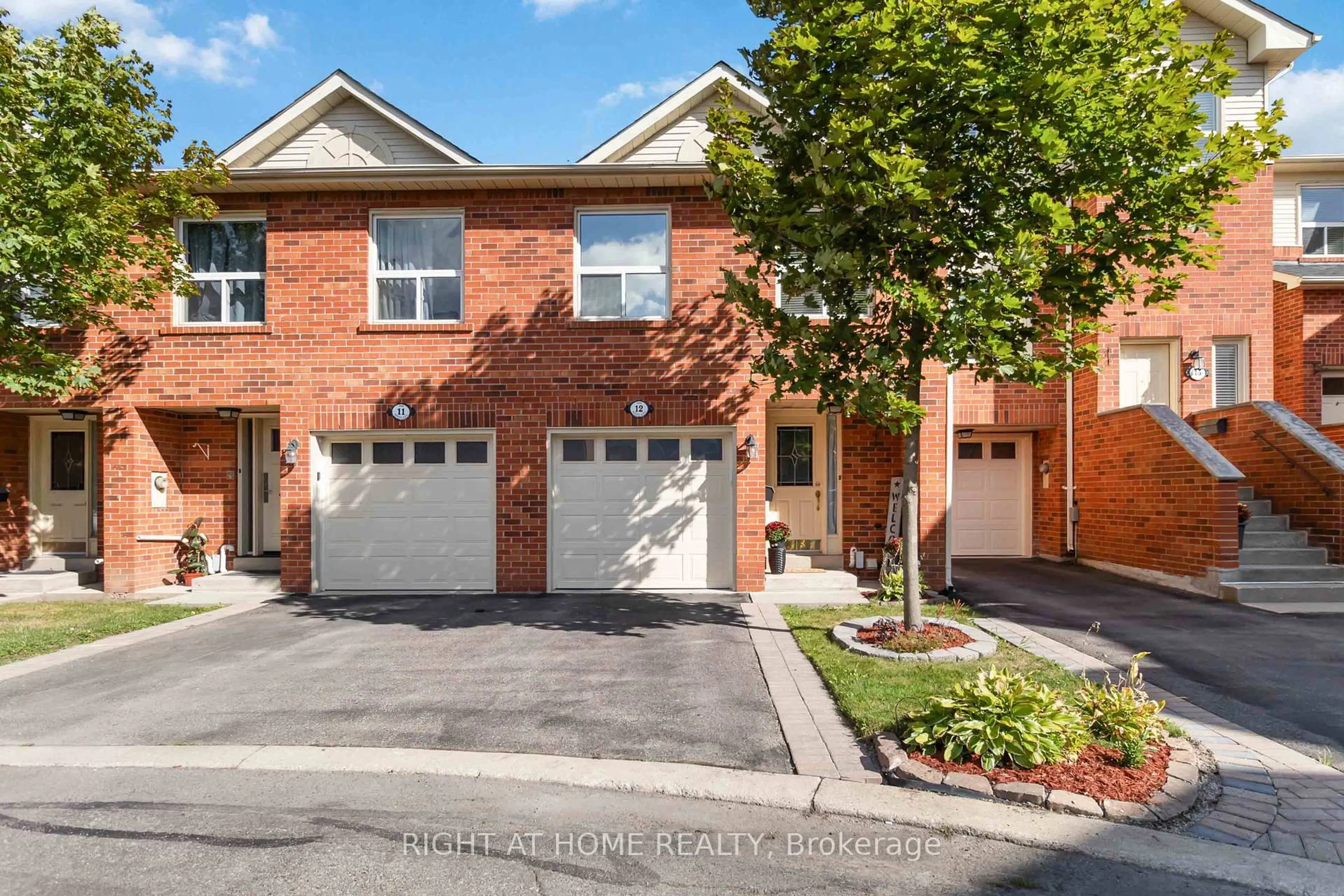 Home with brick exterior material, street for 1520 Reeves Gate #12, Oakville Ontario L6M 3J4