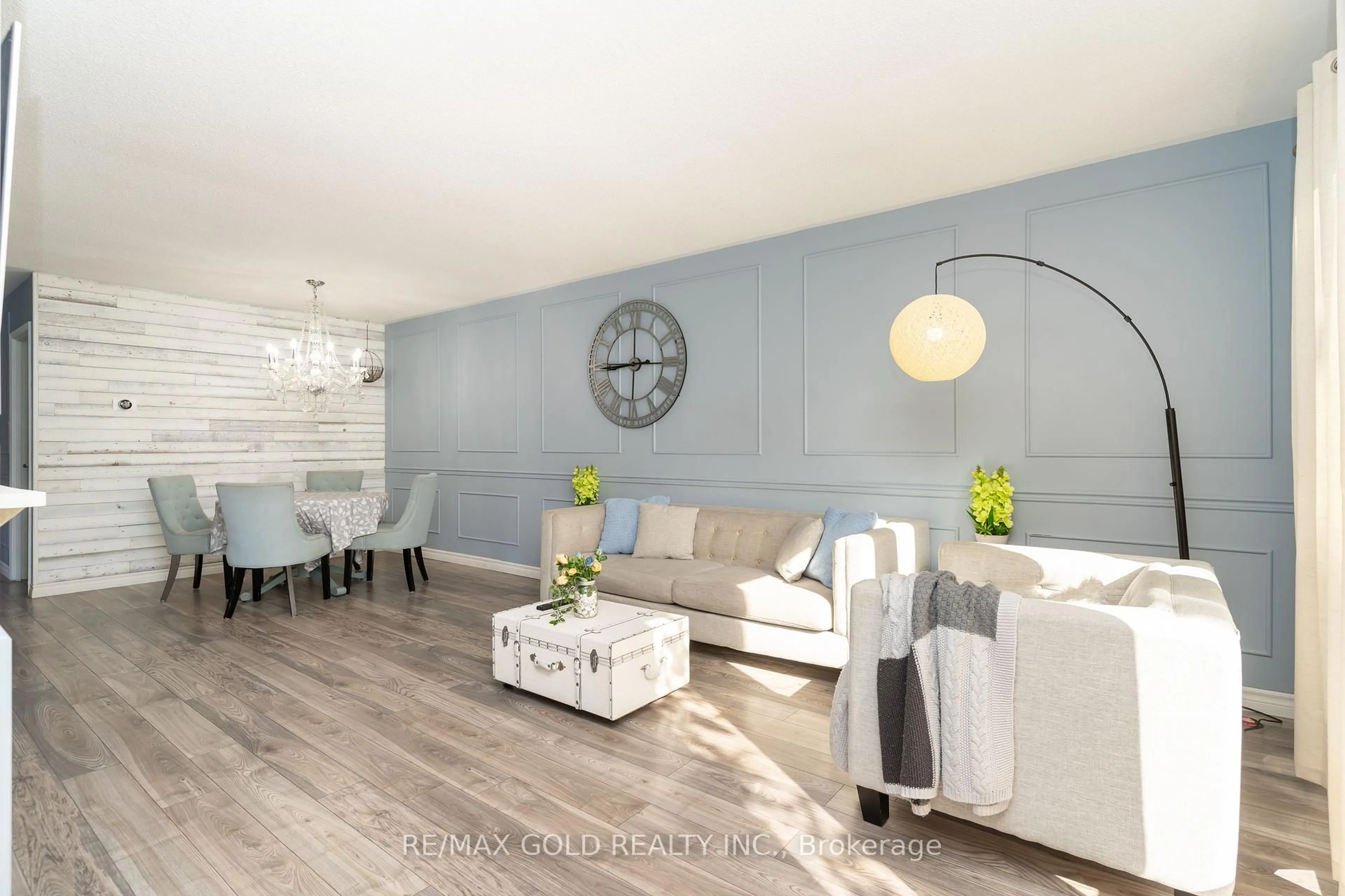 Living room with furniture, wood/laminate floor for 4 Deeside Cres, Brampton Ontario L6T 3L7