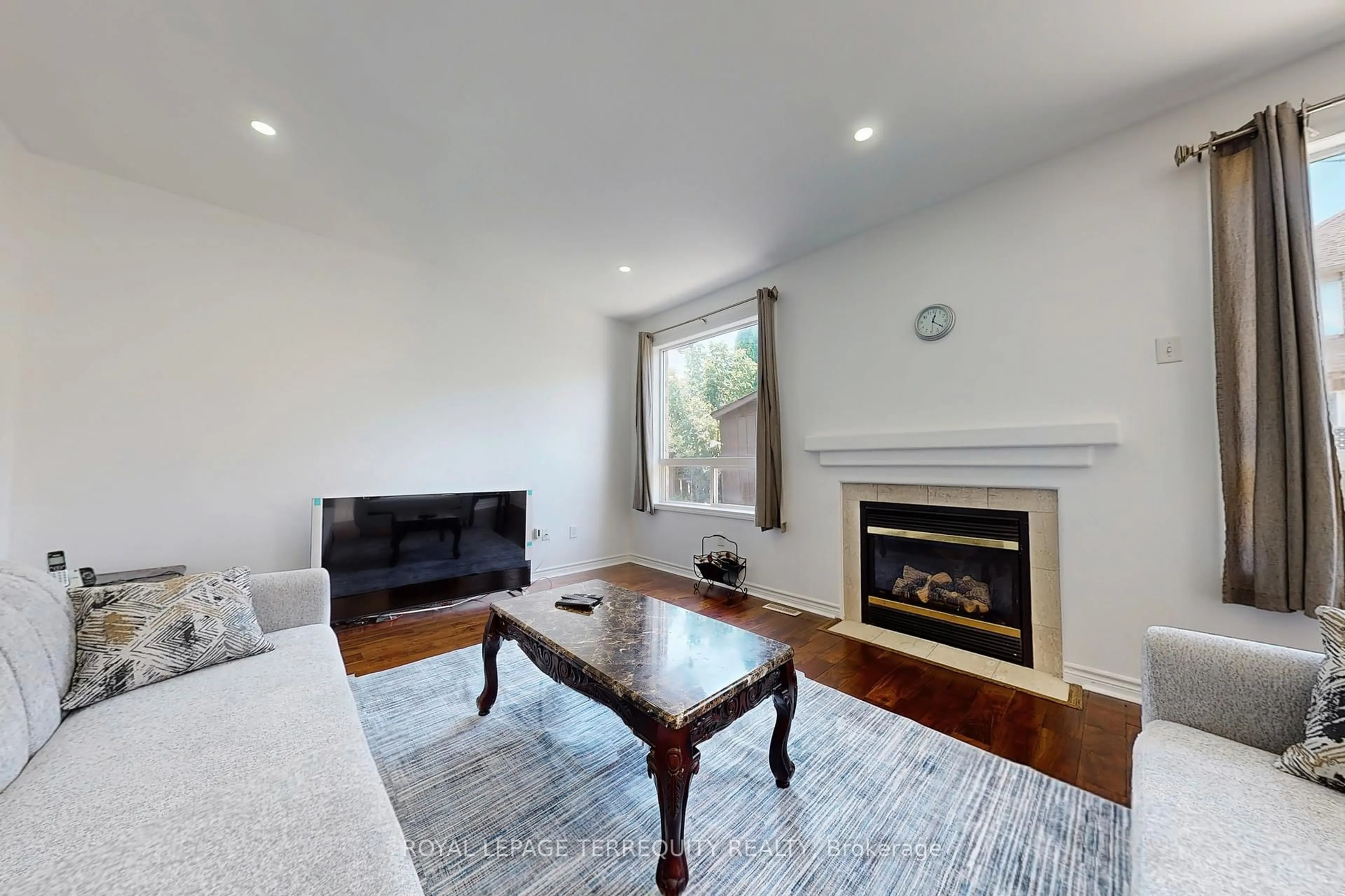 Living room with furniture, wood/laminate floor for 6 Verona Dr, Brampton Ontario L6P 1L2