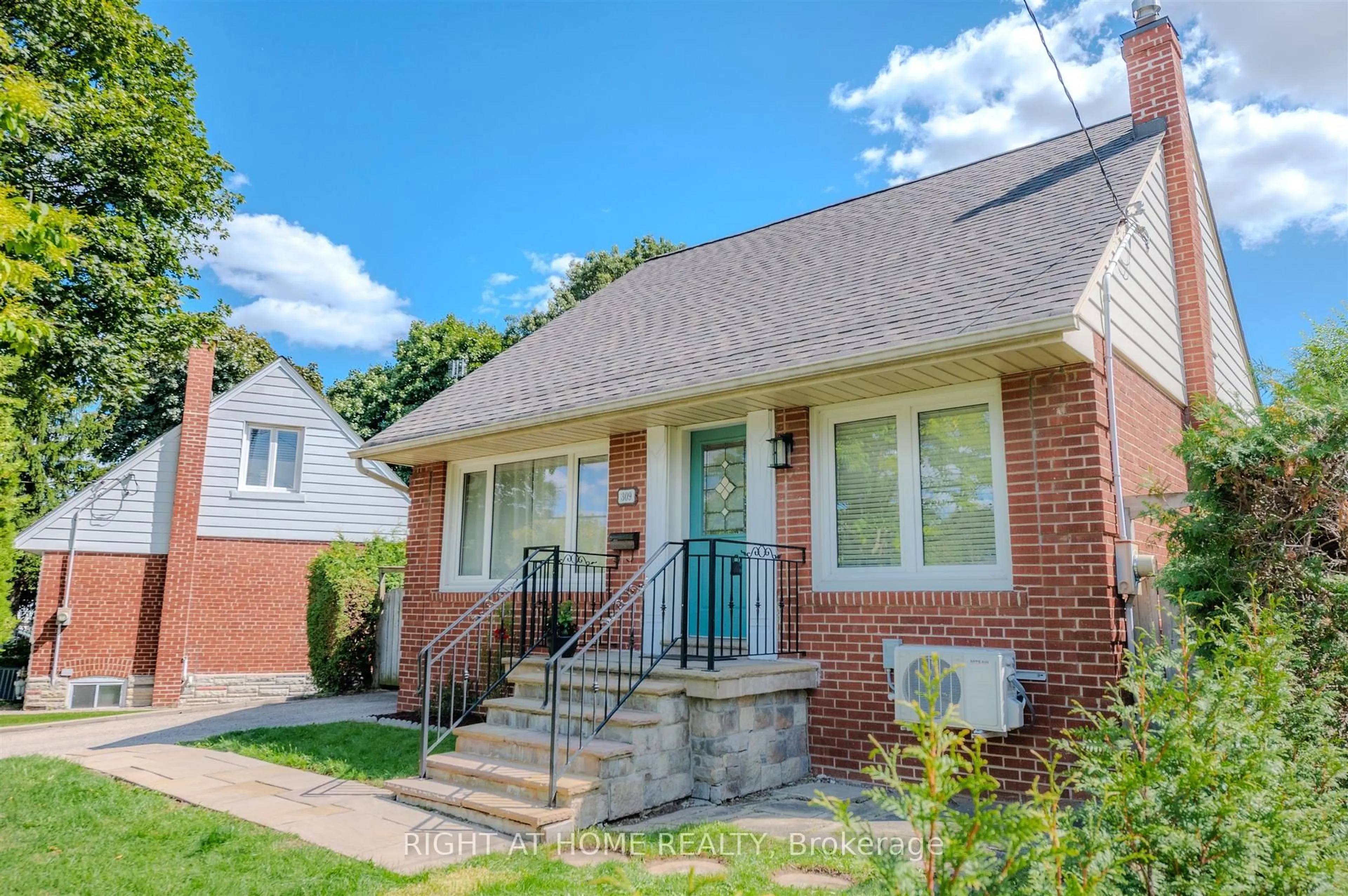 Home with brick exterior material, street for 309 Rathburn Rd, Toronto Ontario M9B 2L7