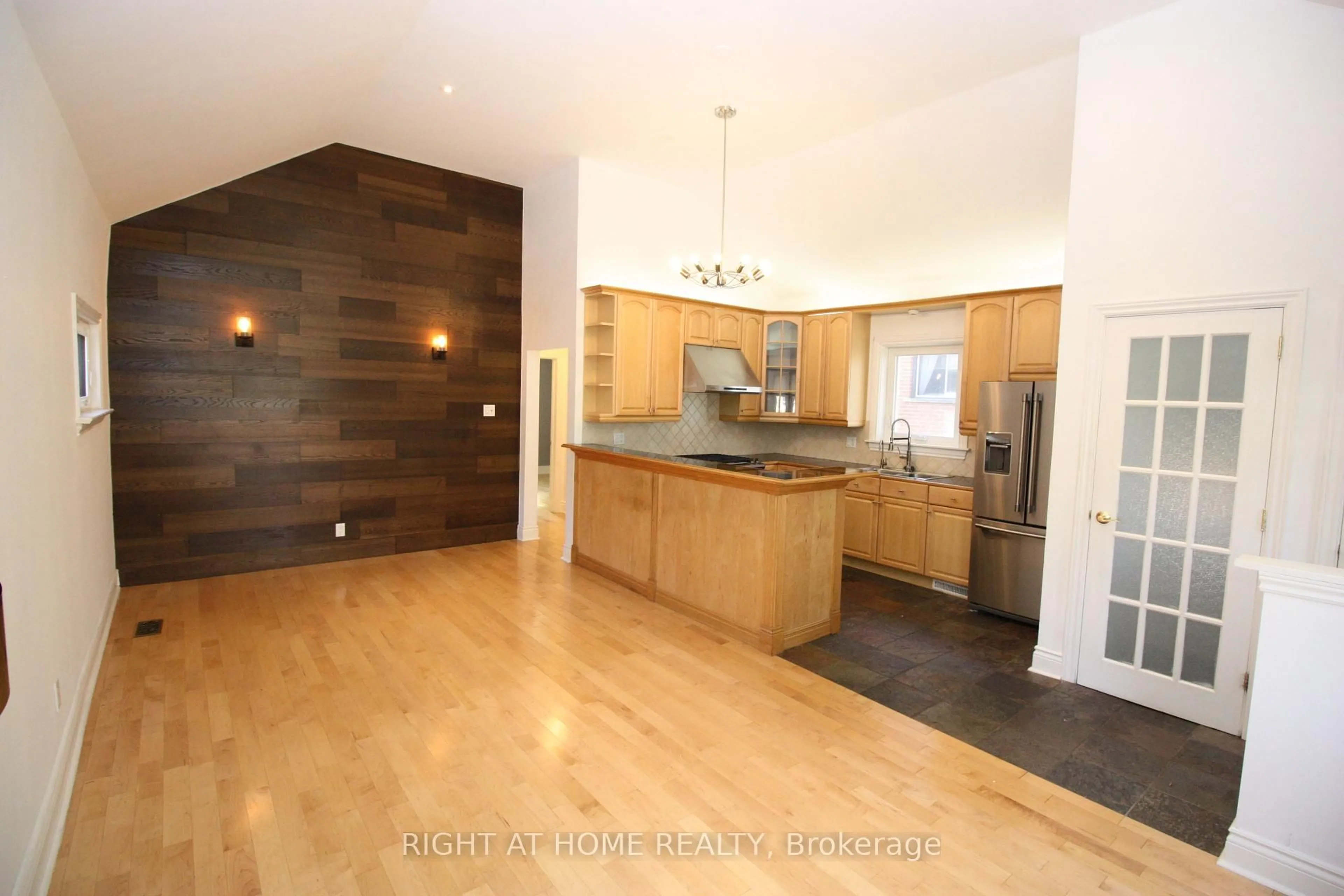 Open concept kitchen, wood/laminate floor for 479 Rimilton Ave, Toronto Ontario M8W 2H2