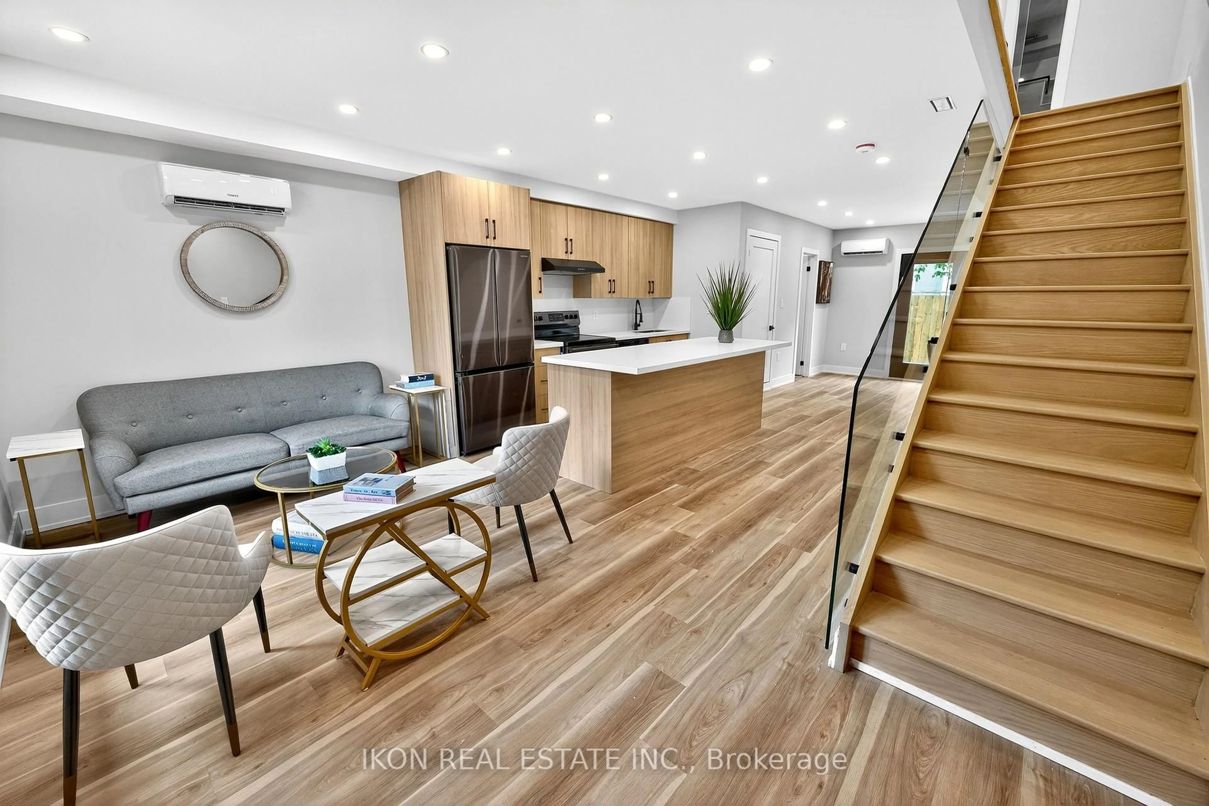 Open concept kitchen, wood/laminate floor for 477 Lane South Dupont East Dalaware Lane, Toronto Ontario M6H 2V1