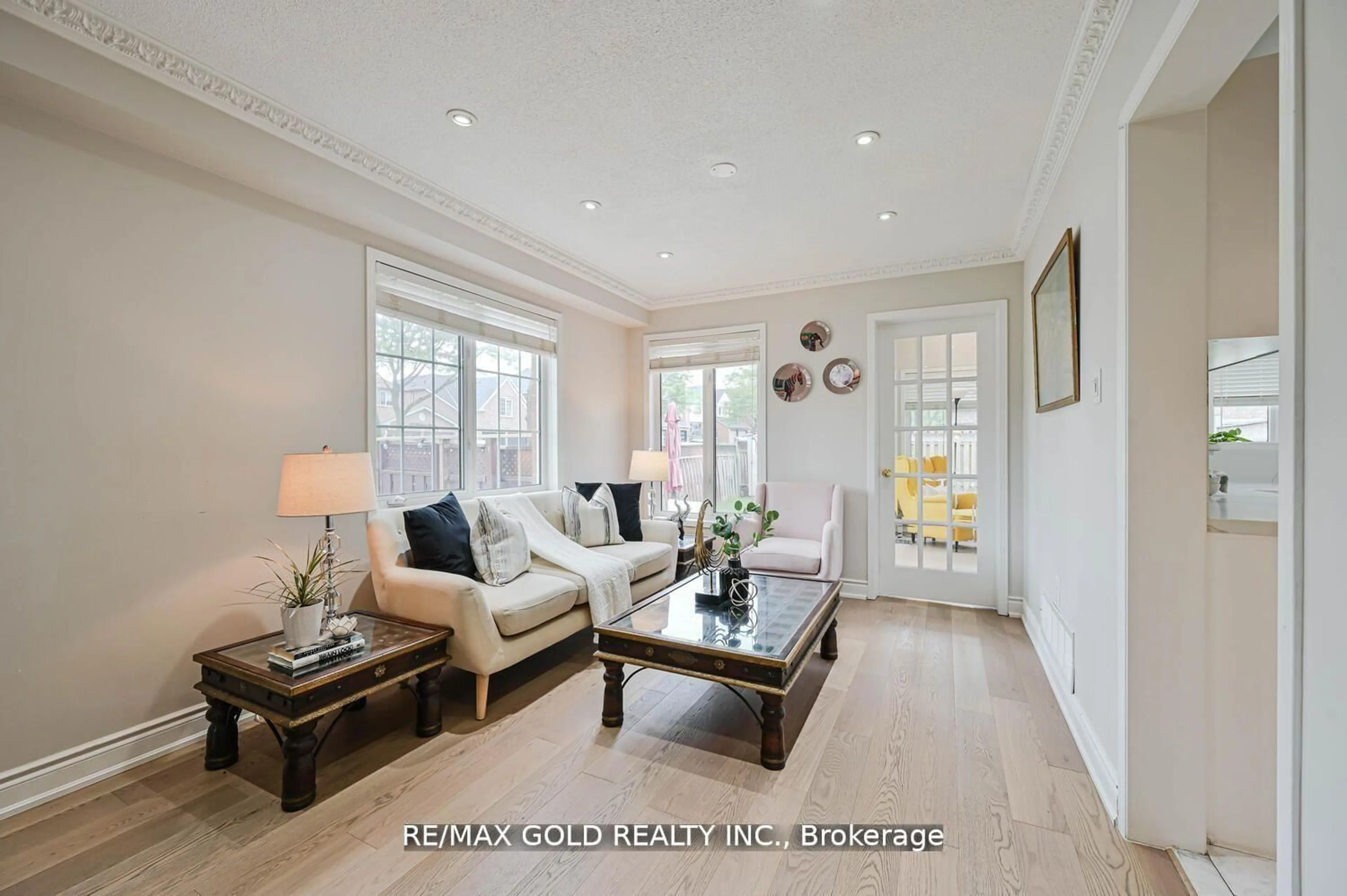 Living room with furniture, wood/laminate floor for 44 Ribbon Dr, Brampton Ontario L6R 2C5