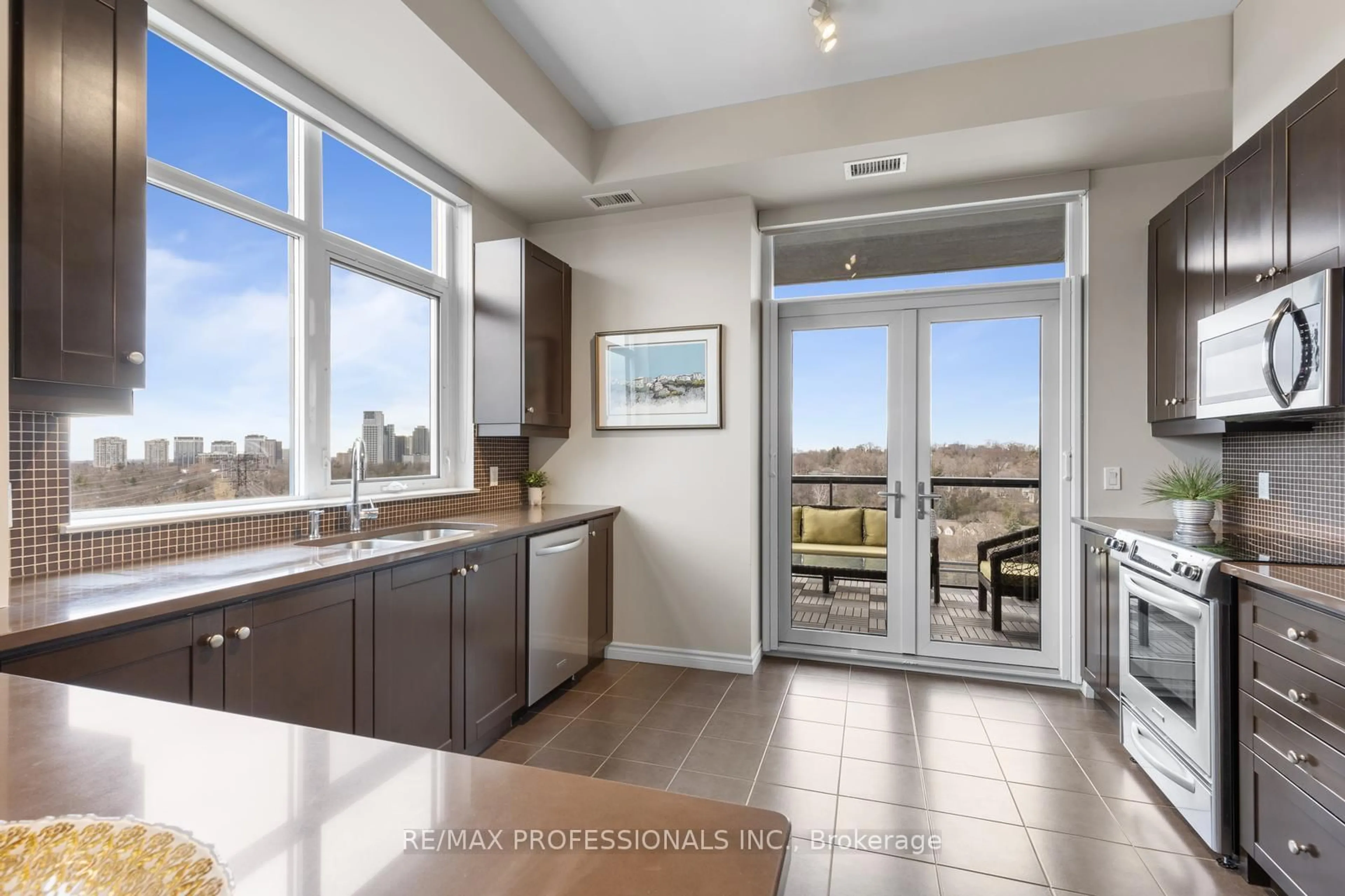 Open concept kitchen, ceramic/tile floor for 1135 Royal York Rd #1203, Toronto Ontario M9A 0C3
