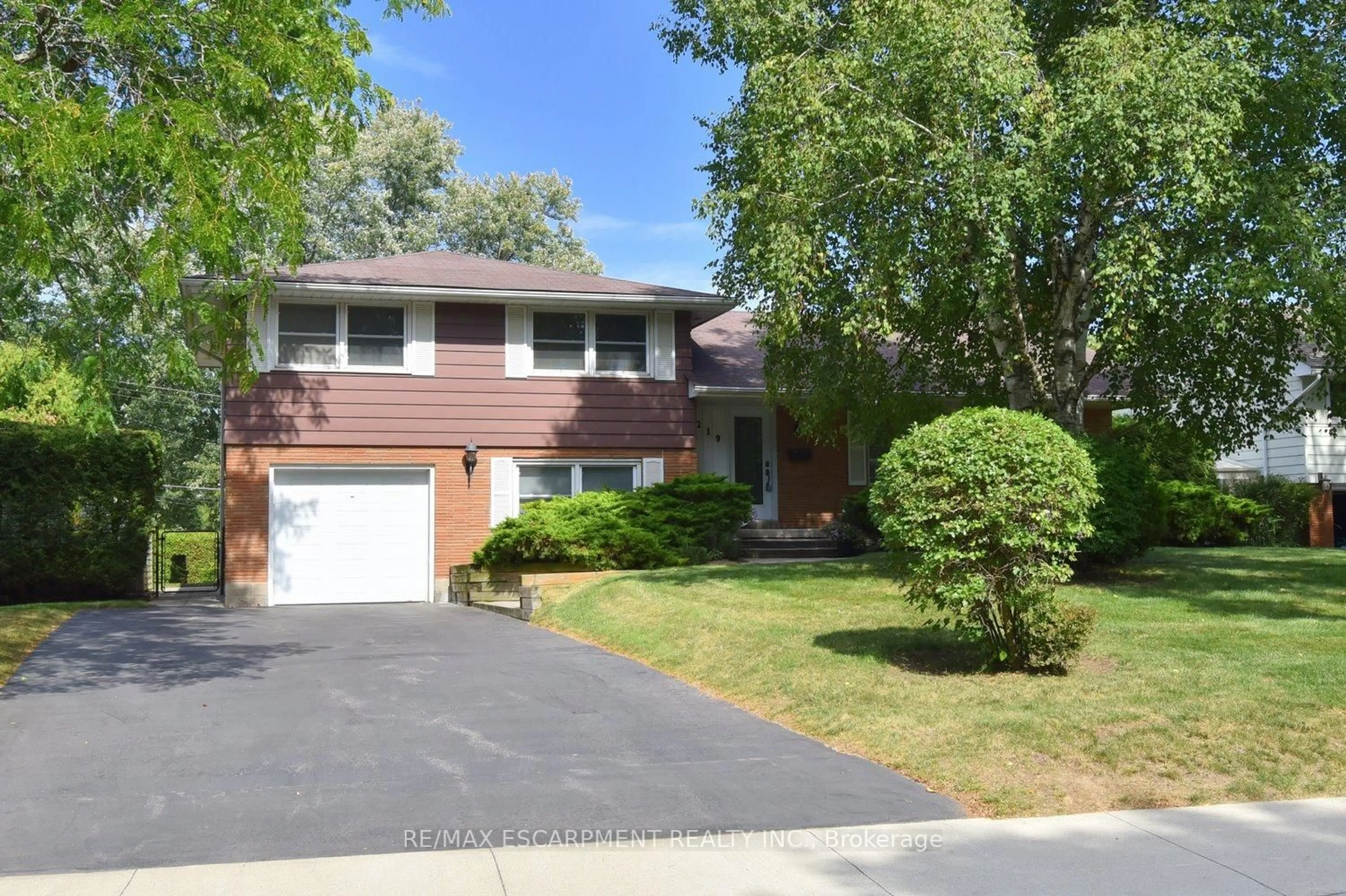 Home with brick exterior material, street for 219 Strathcona Dr, Burlington Ontario L7L 2C7