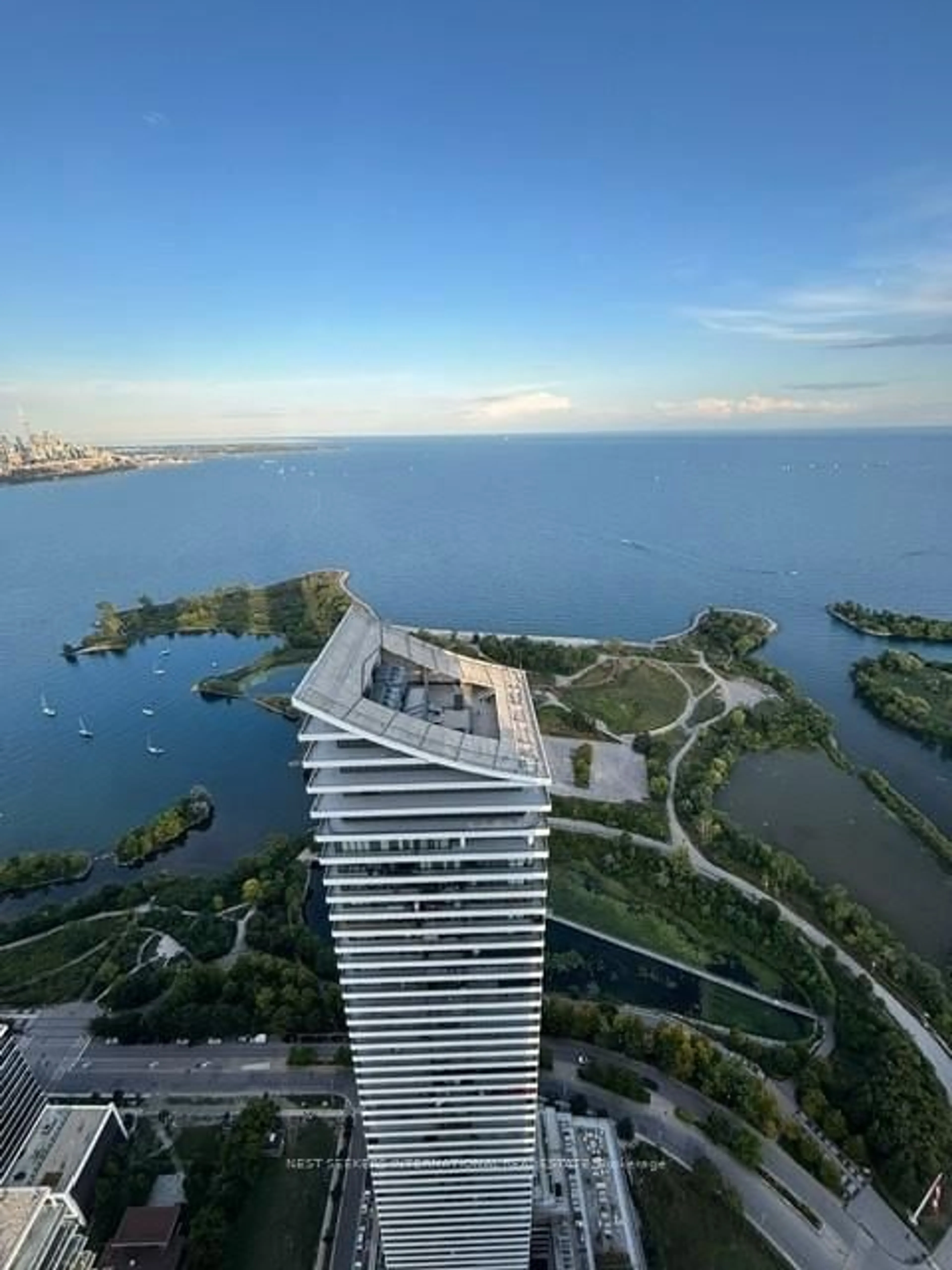 A pic from outside/outdoor area/front of a property/back of a property/a pic from drone, water/lake/river/ocean view for 30 Shore Breeze Dr #LPH 03A, Toronto Ontario M8V 1A1