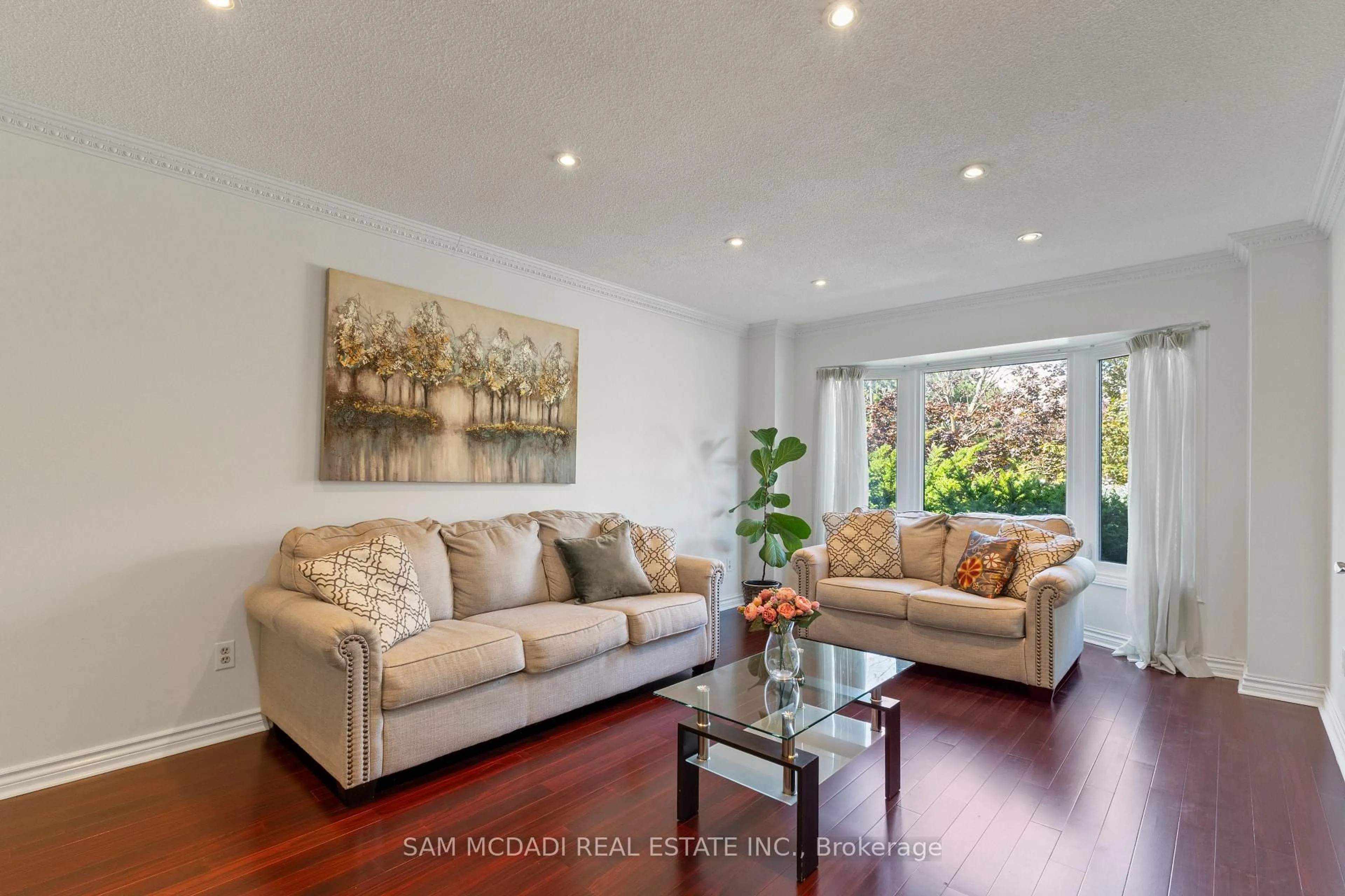 Living room with furniture, wood/laminate floor for 3068 Prentiss Rd, Mississauga Ontario L5L 3W6