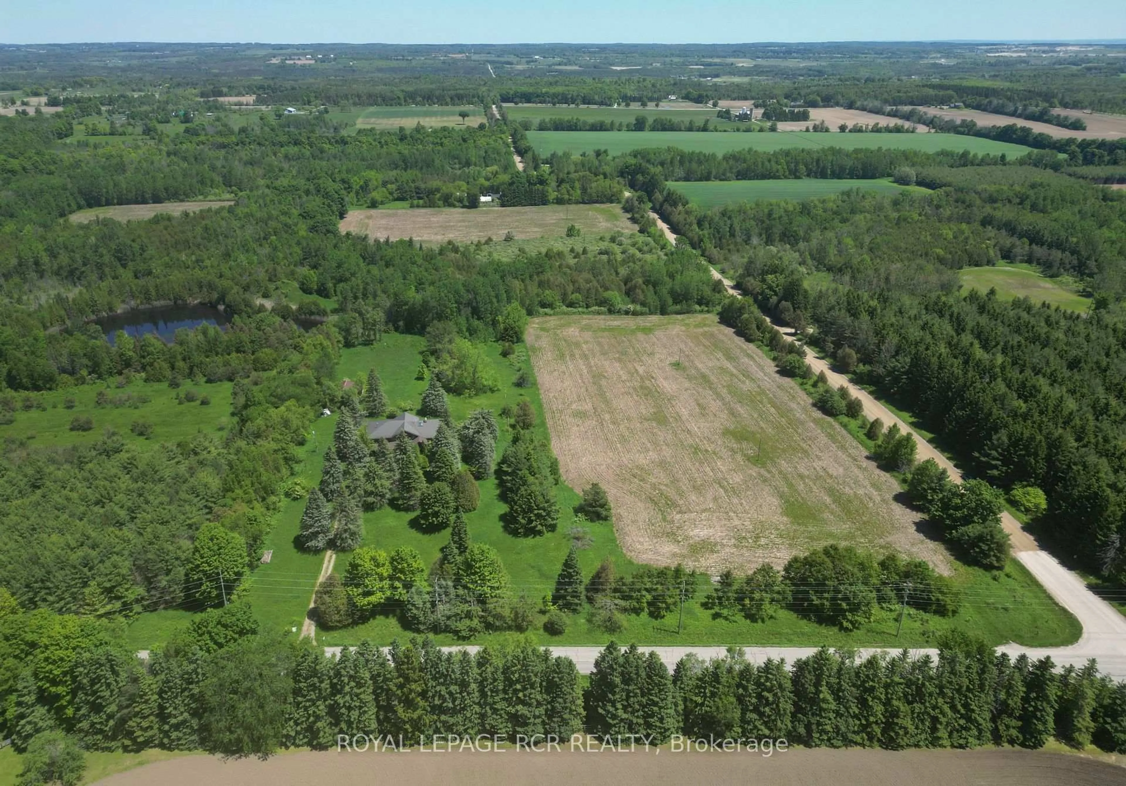 A pic from outside/outdoor area/front of a property/back of a property/a pic from drone, forest/trees view for 19455 Shaws Creek Rd, Caledon Ontario L7K 1L5