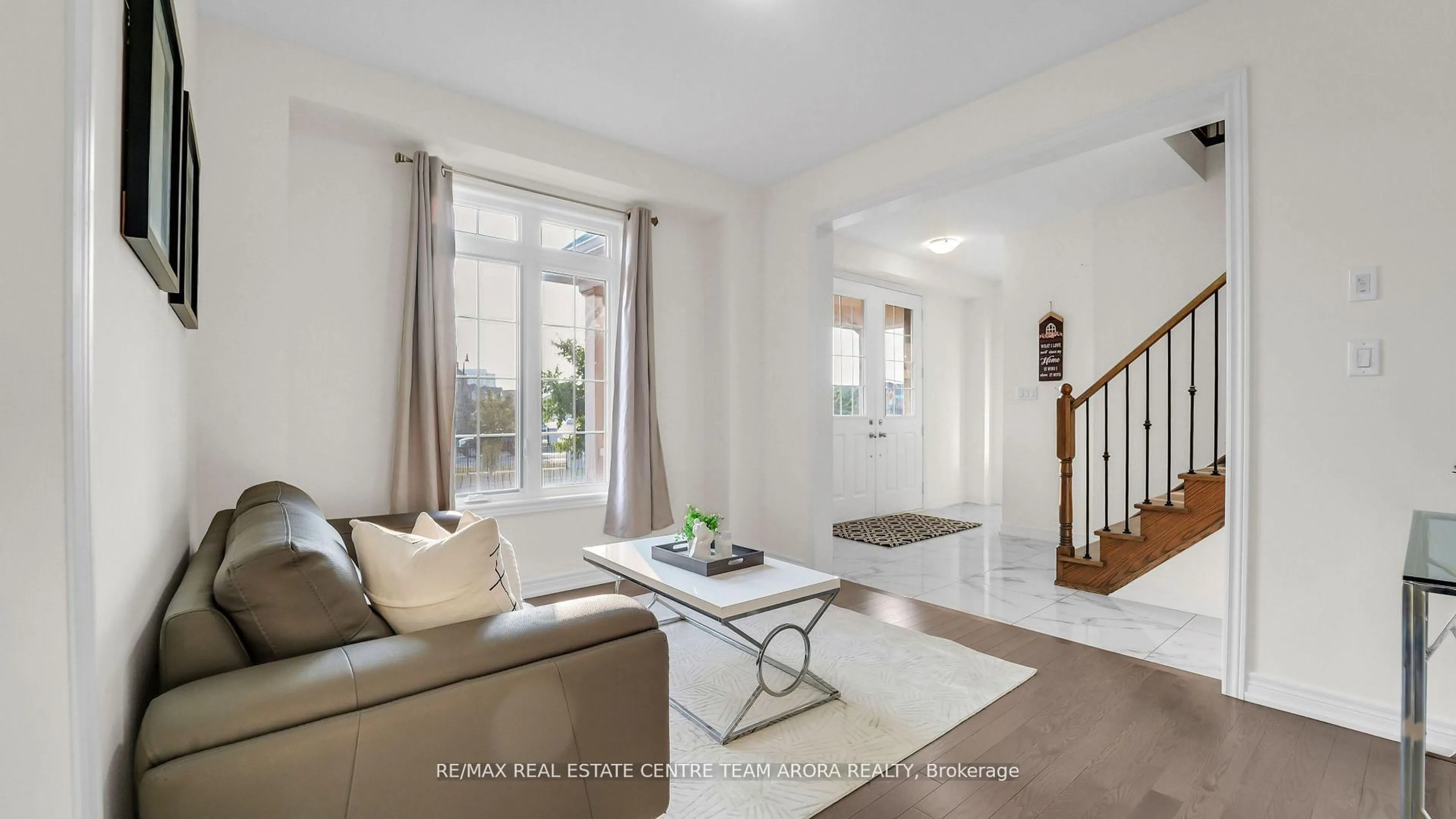 Living room with furniture, ceramic/tile floor for 33 Dunley Cres, Brampton Ontario L6X 5G8