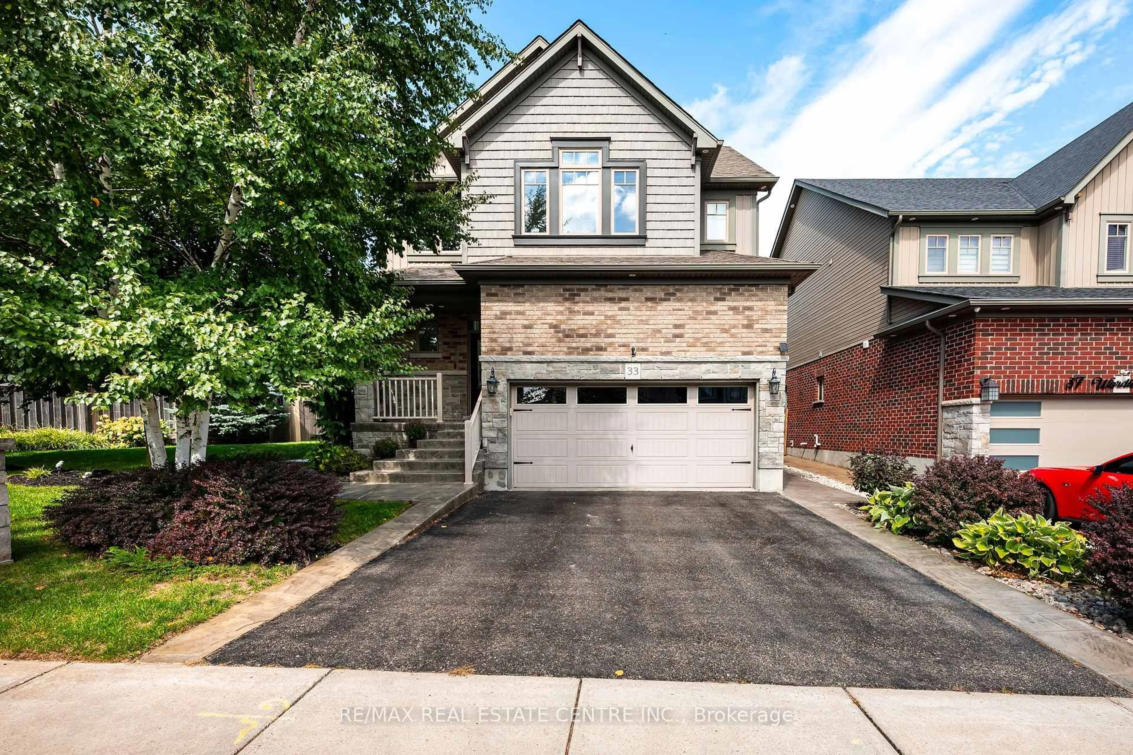 Home with brick exterior material, street for 33 Wardlaw Ave, Orangeville Ontario L9W 6K1