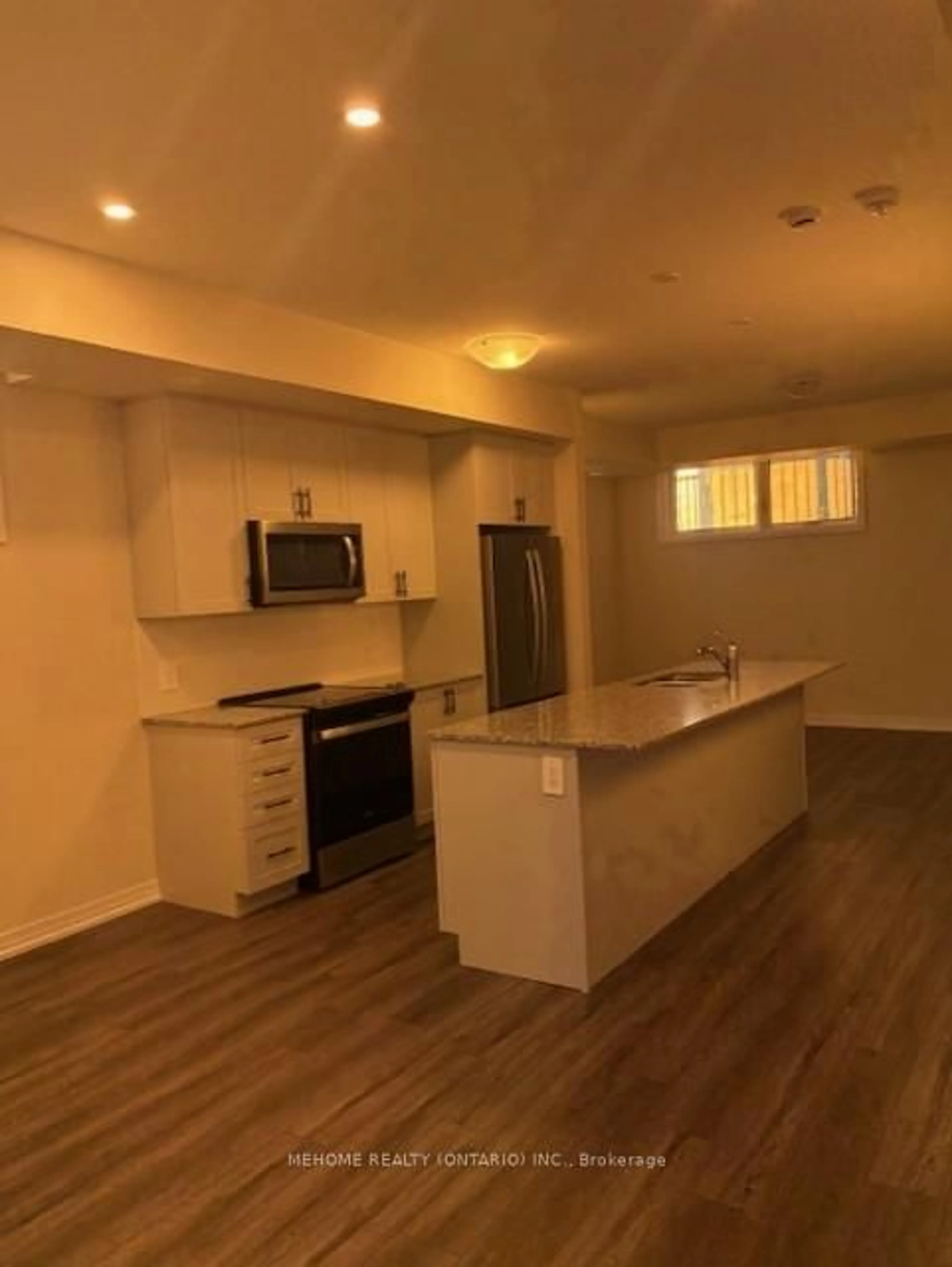 Open concept kitchen, wood/laminate floor for 1585 Rose Way, Milton Ontario L9T 7E7