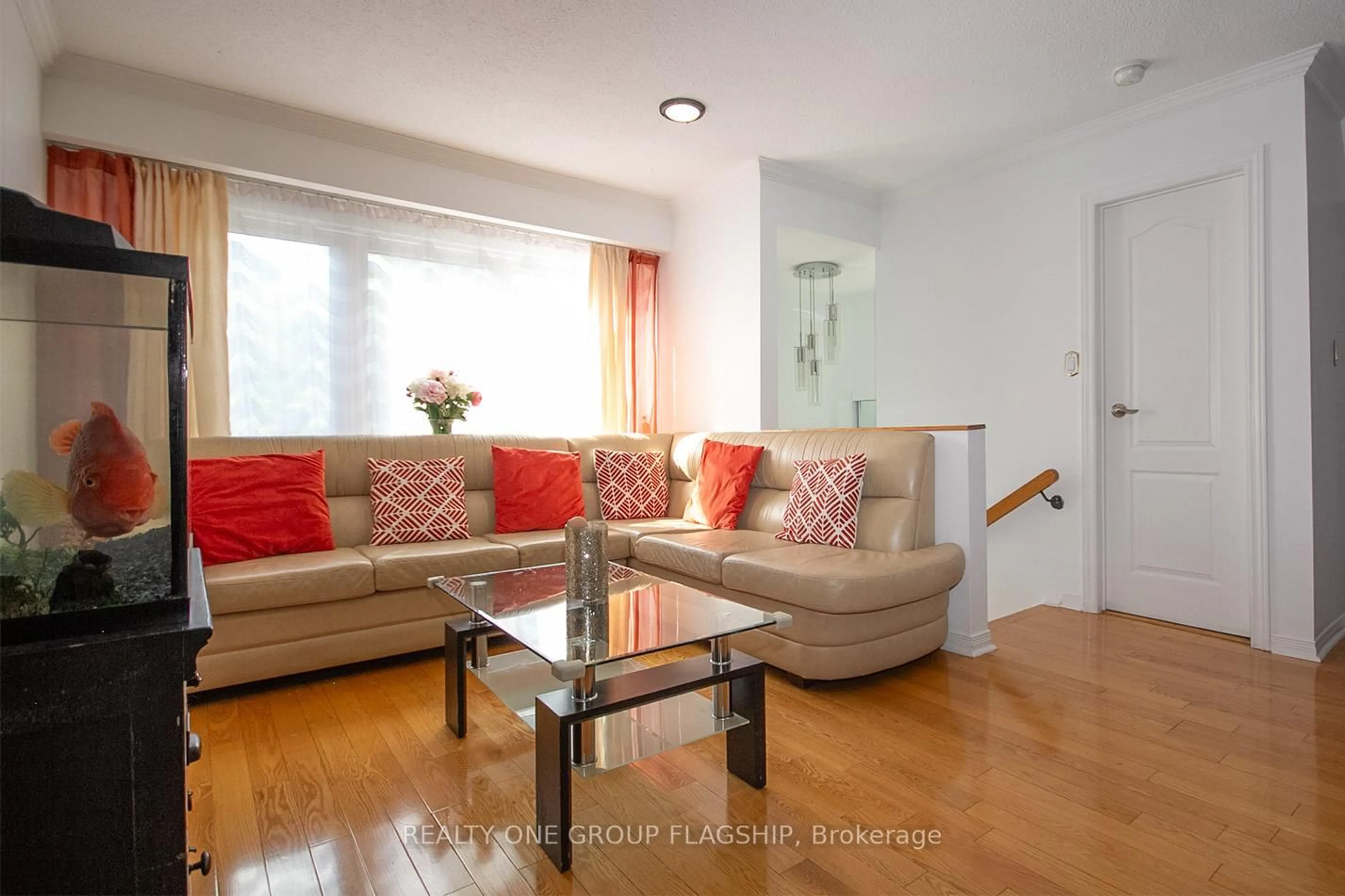 Living room with furniture, wood/laminate floor for 71 Maple Branch Path #36, Toronto Ontario M9P 3T4