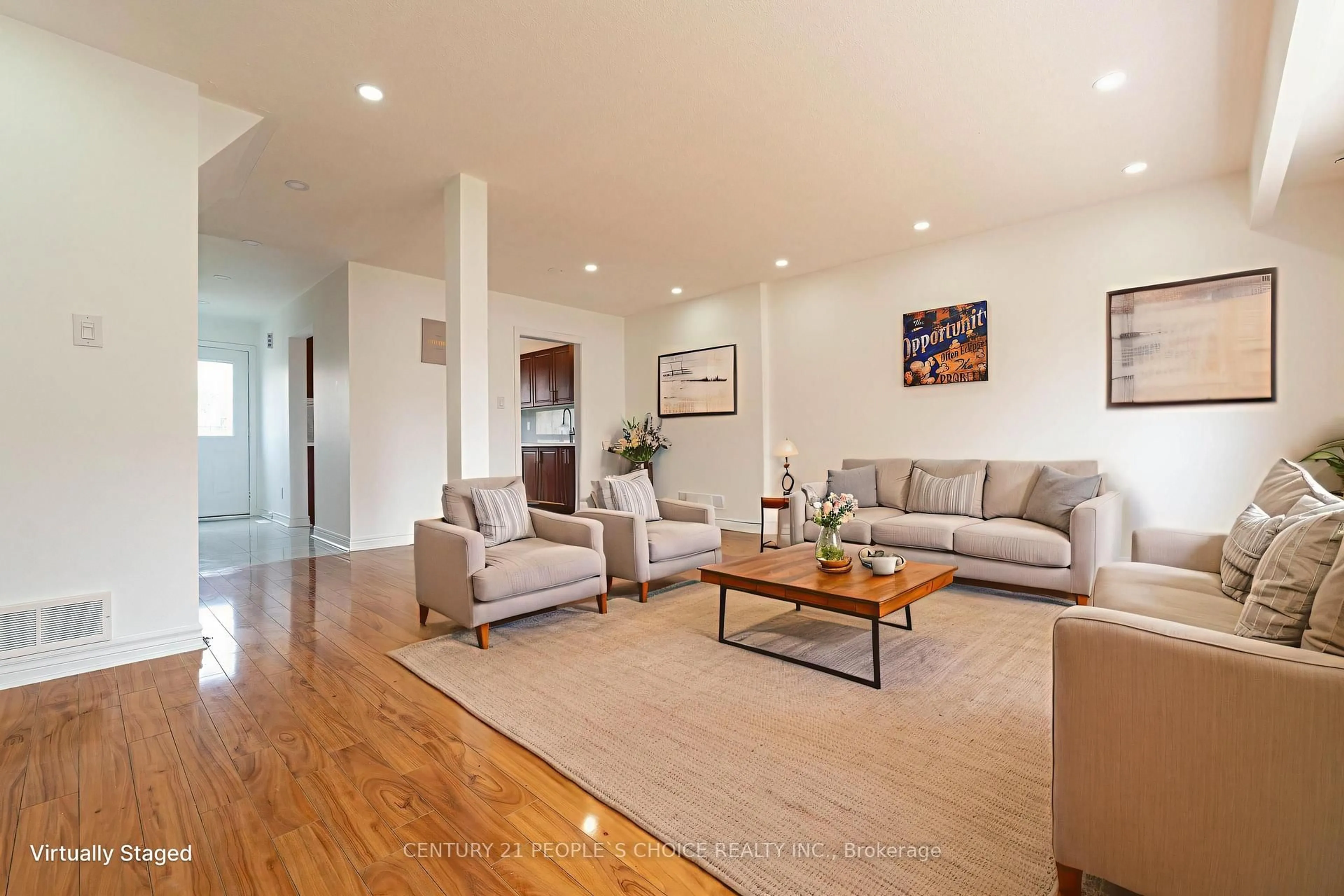 Living room with furniture, wood/laminate floor for 7440 Goreway Dr #28, Mississauga Ontario L4T 2V2