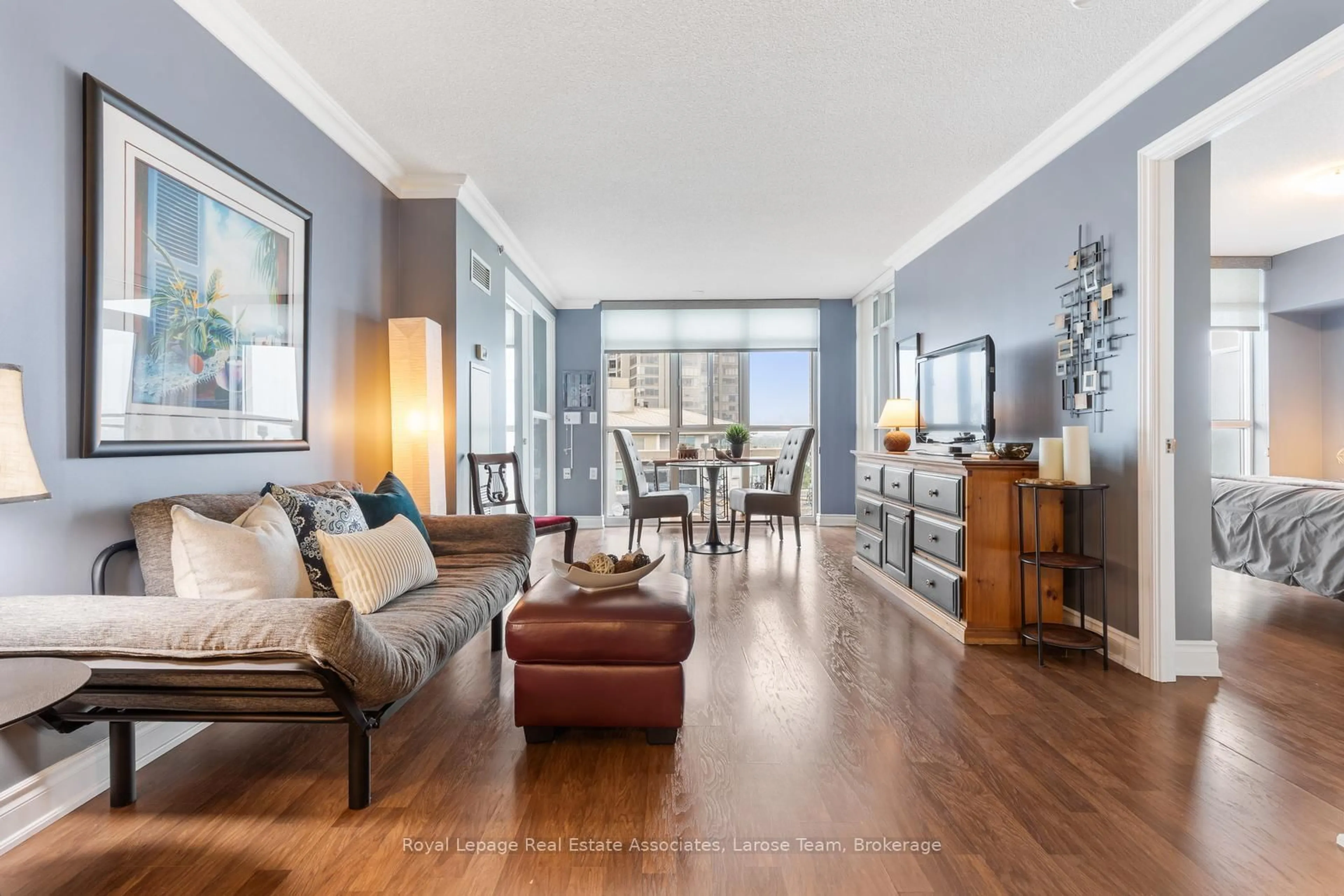 Living room with furniture, wood/laminate floor for 3 Marine Parade Dr #1801, Toronto Ontario M8N 3Z5