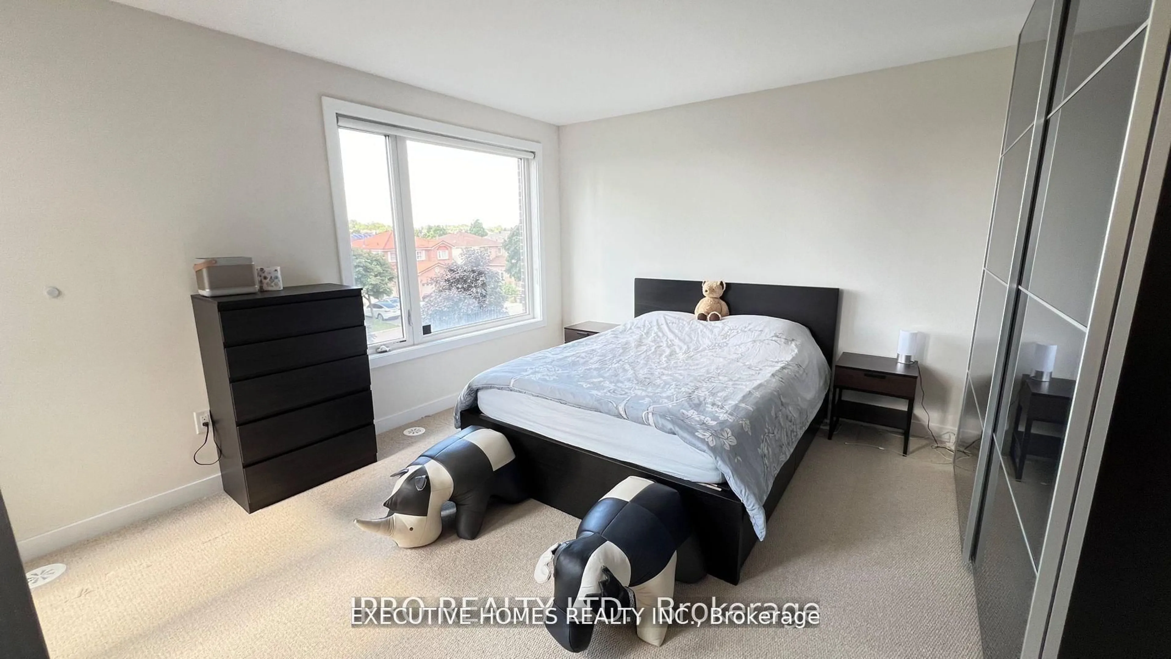 Bedroom with bed, wood/laminate floor for 4020 Parkside Village Dr #9, Mississauga Ontario L5B 0K2