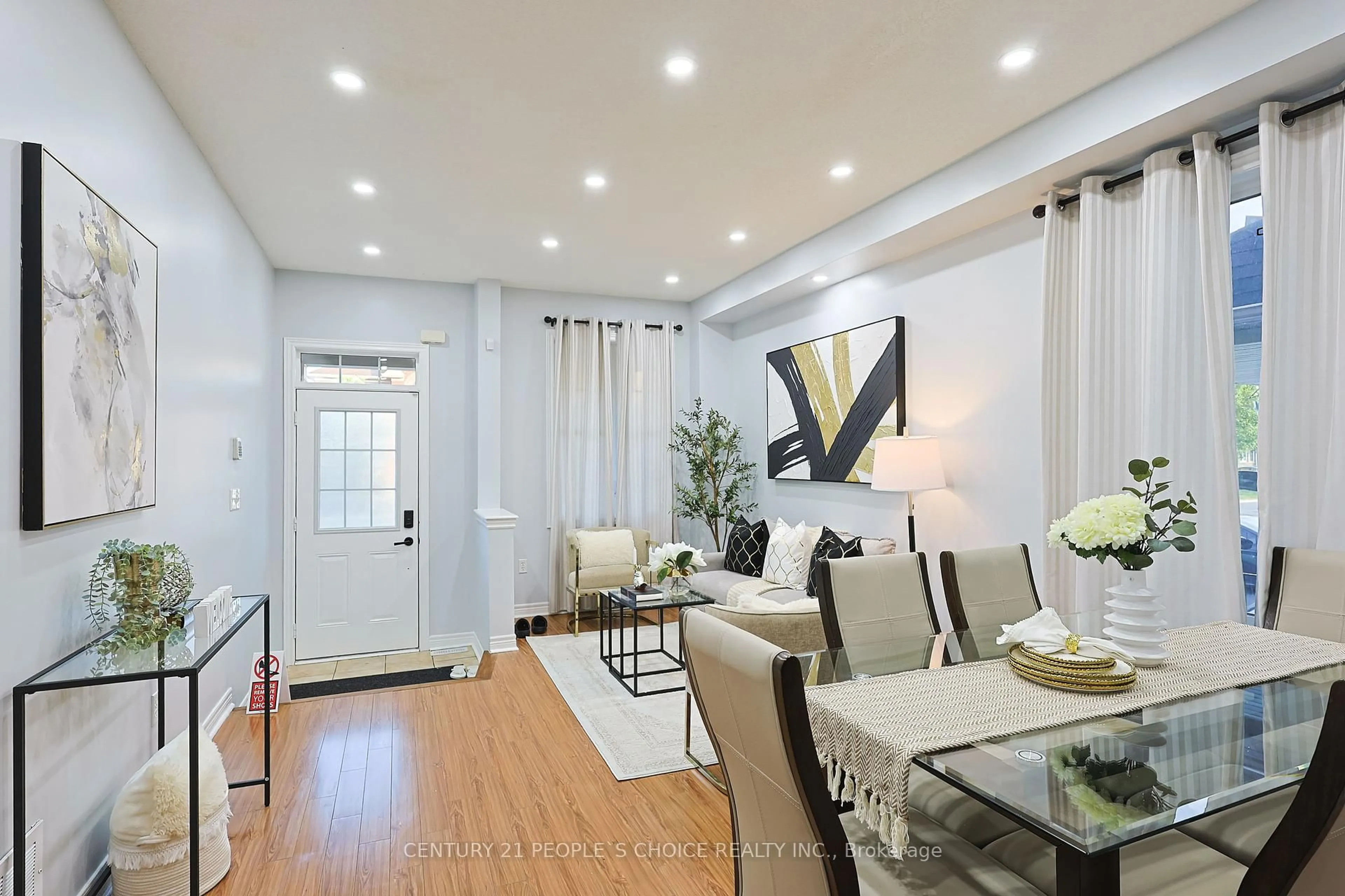 Living room with furniture, wood/laminate floor for 114 Begonia Cres, Brampton Ontario L7A 0M9