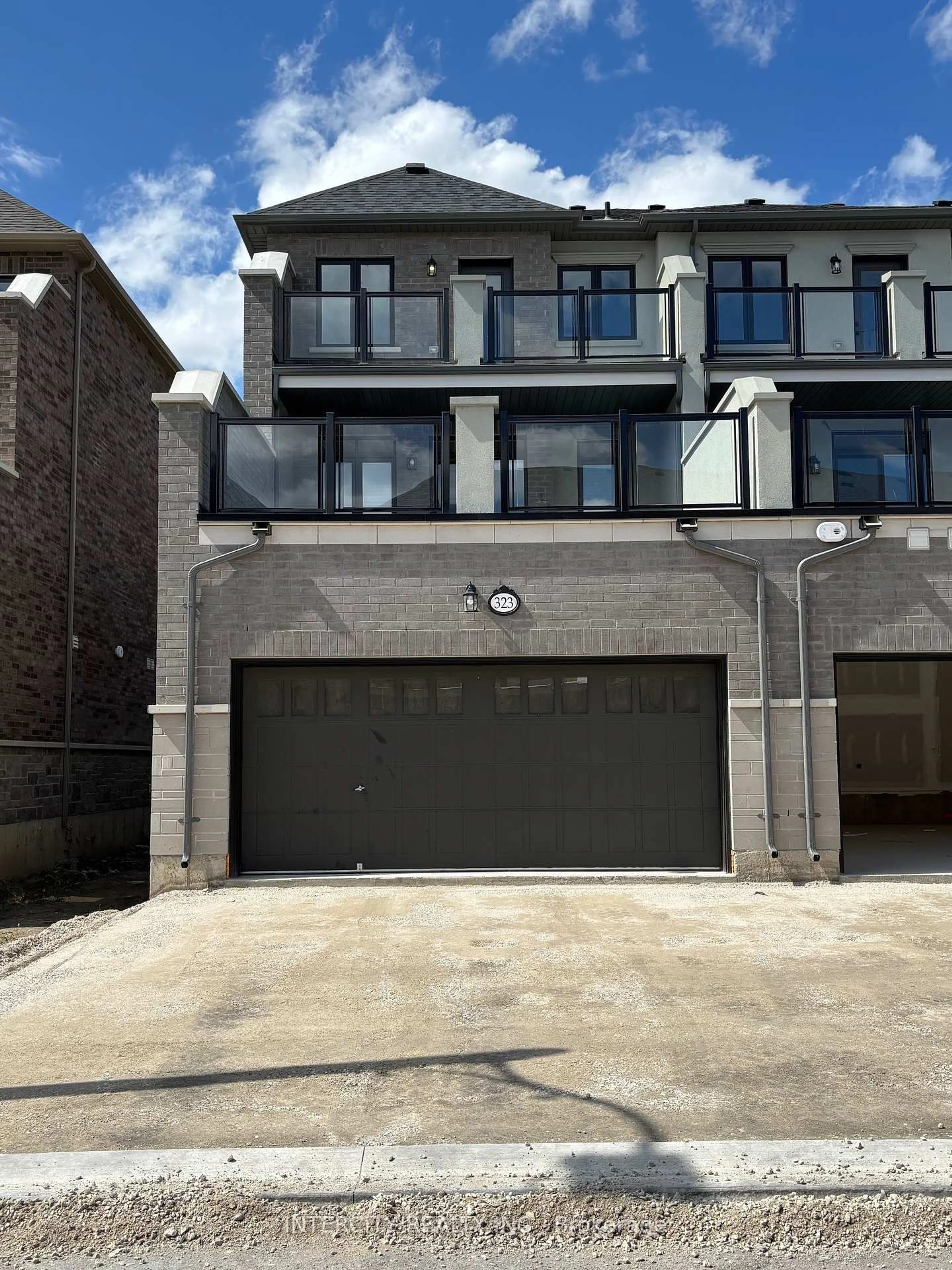 Home with brick exterior material, street for 323 Inspire Blvd, Brampton Ontario L6R 4E6