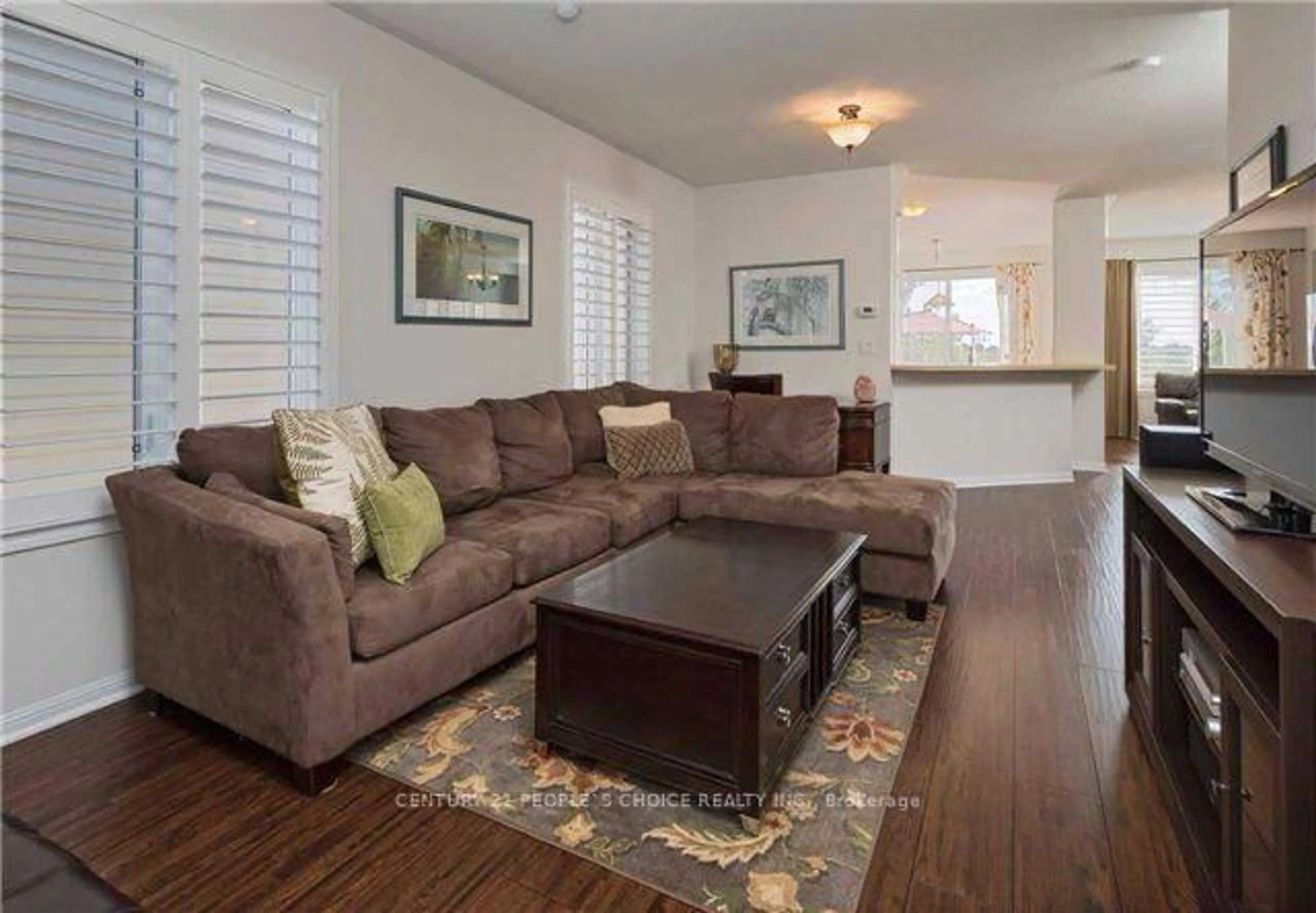 Living room with furniture, wood/laminate floor for 4 Locomotive Cres, Brampton Ontario L7A 0T7