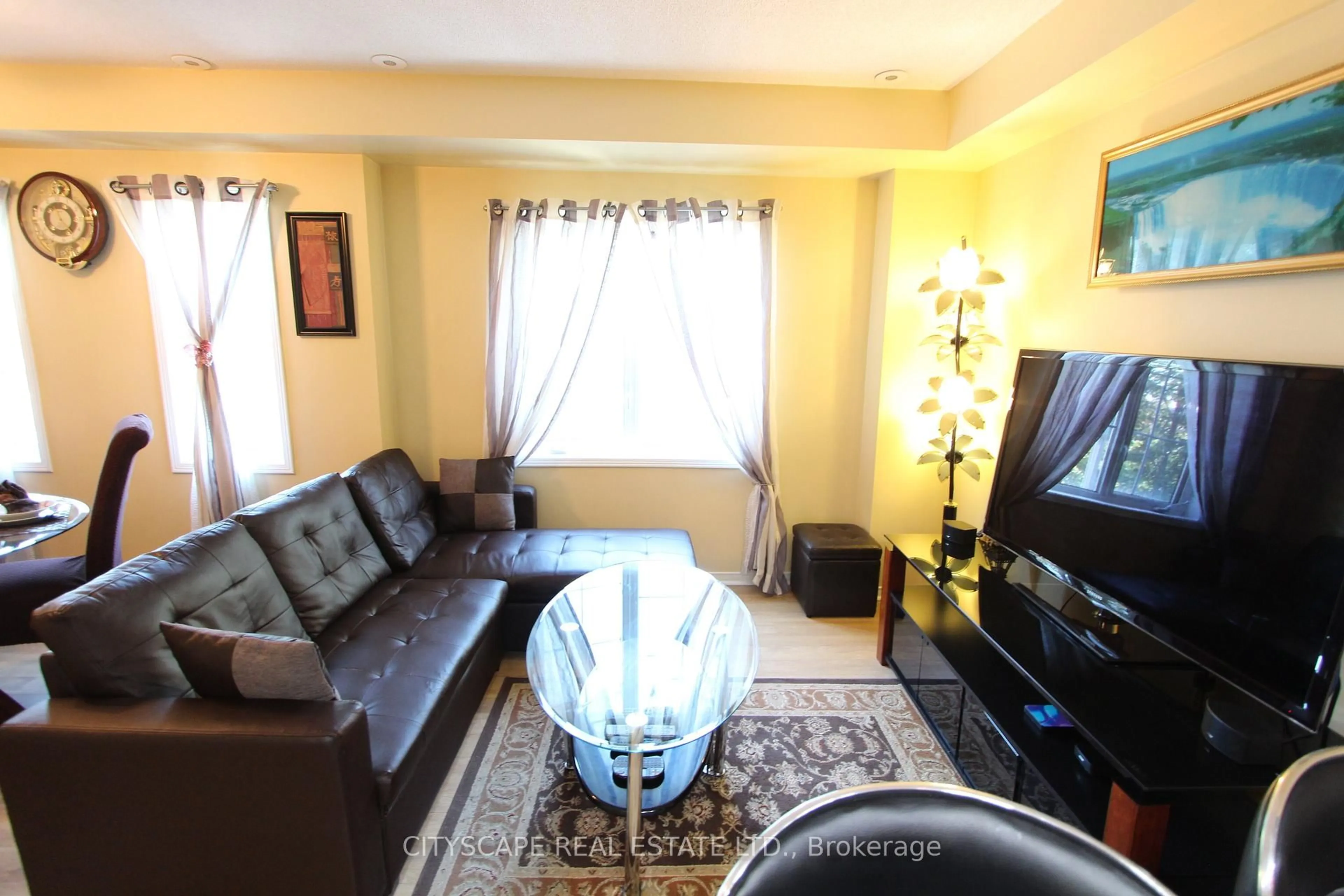 Living room with furniture, unknown for 3055 Elmcreek Rd ##7, Mississauga Ontario L5B 4J9