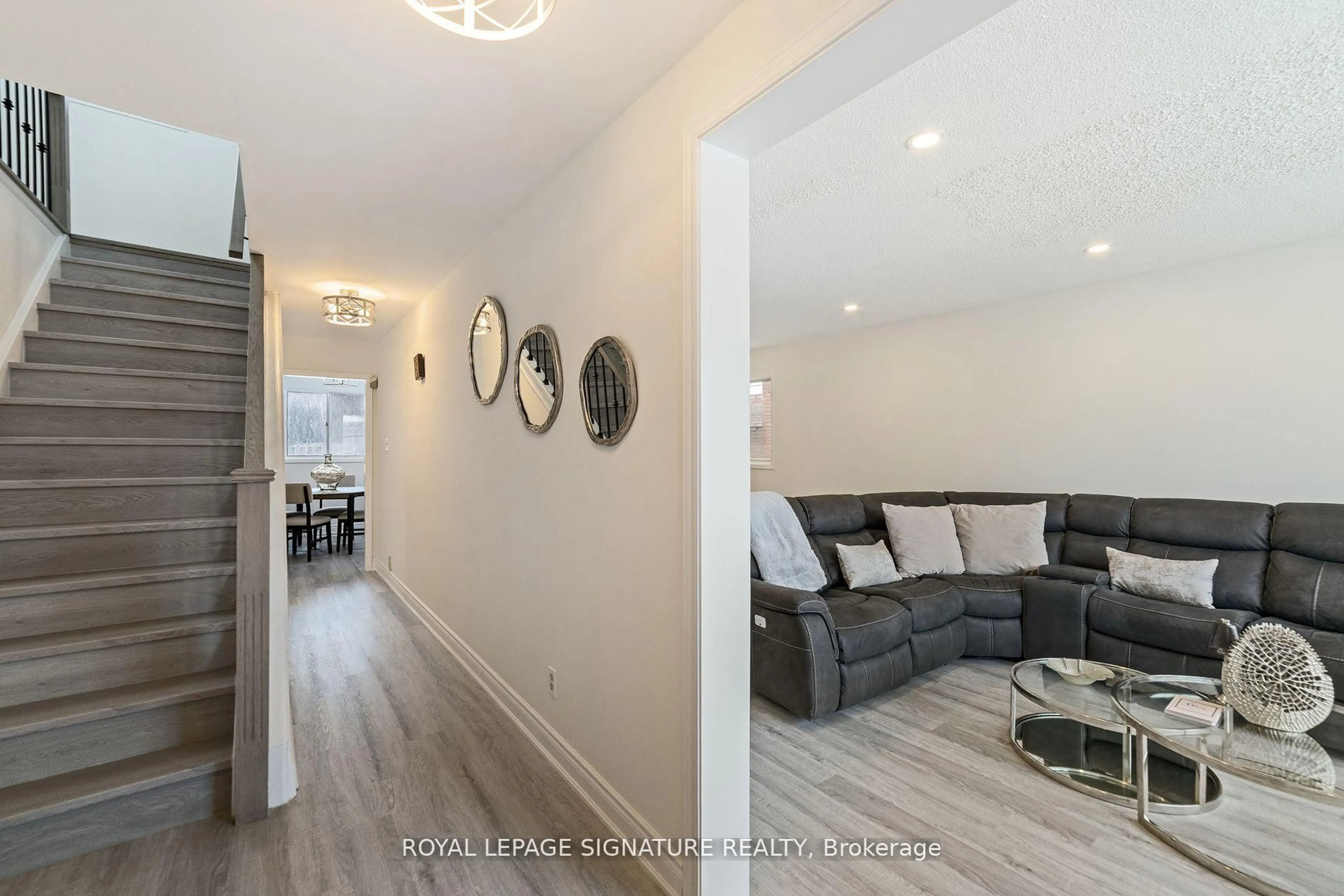 Living room with furniture, wood/laminate floor for 11 Kirkland Rd, Brampton Ontario L6V 2W5