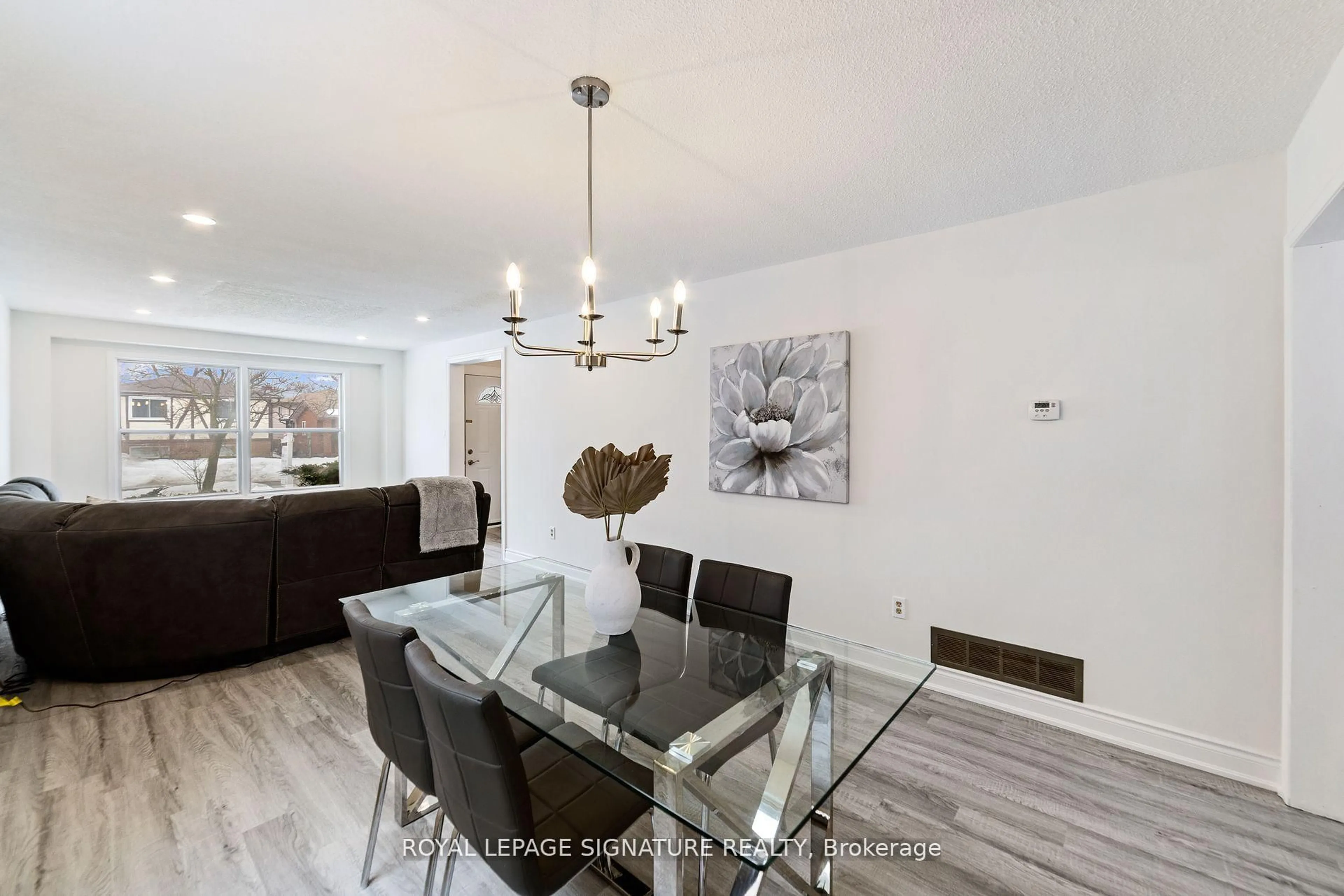 Dining room, wood/laminate floor for 11 Kirkland Rd, Brampton Ontario L6V 2W5