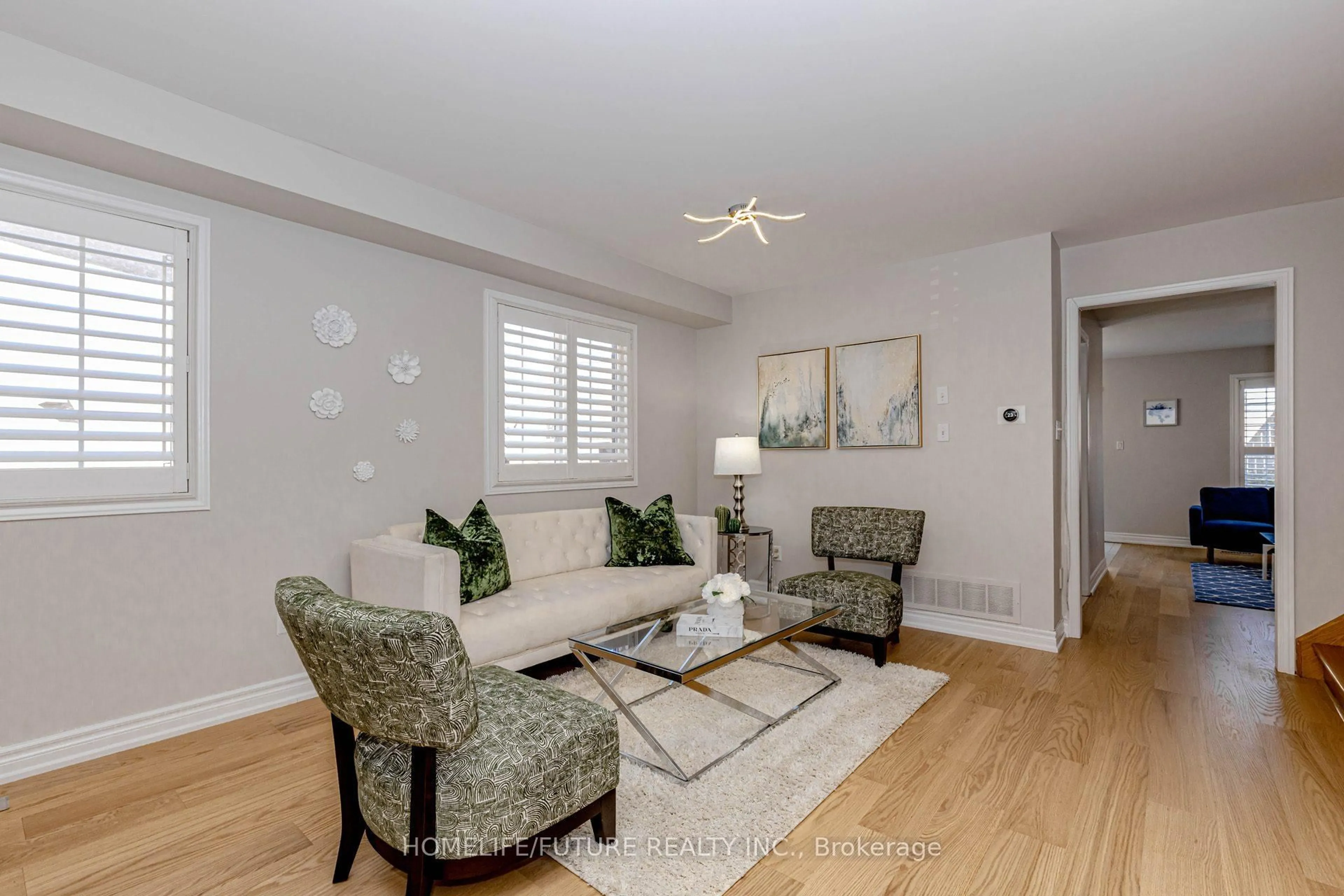 Living room with furniture, wood/laminate floor for 137 Zia Dodda Cres, Brampton Ontario L6P 1J3