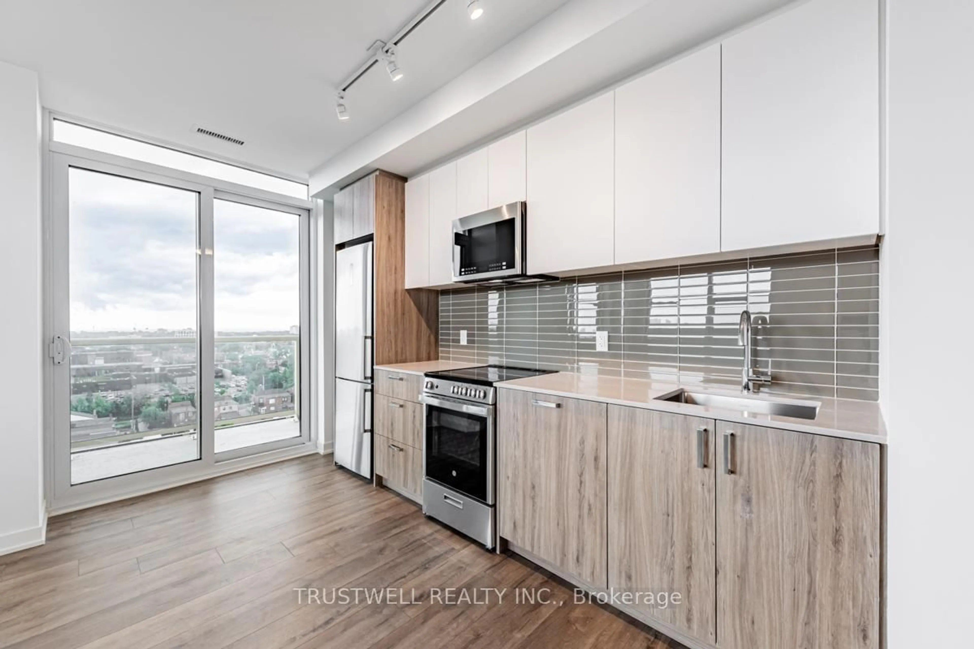 Open concept kitchen, wood/laminate floor for 1787 St Clair Ave #1107, Toronto Ontario M6N 0B7
