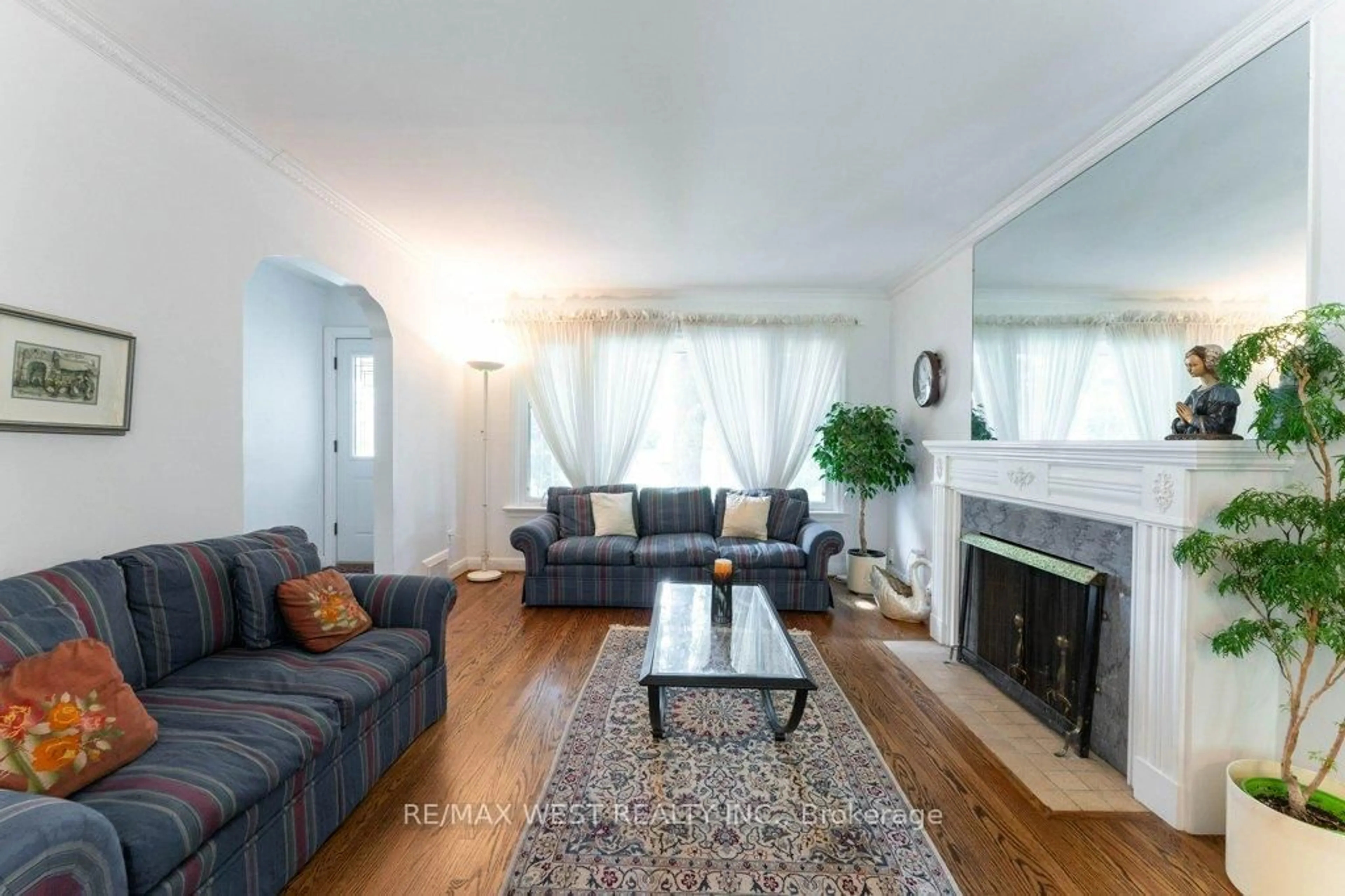 Living room with furniture, wood/laminate floor for 216 Berry Rd, Toronto Ontario M8Y 1X4