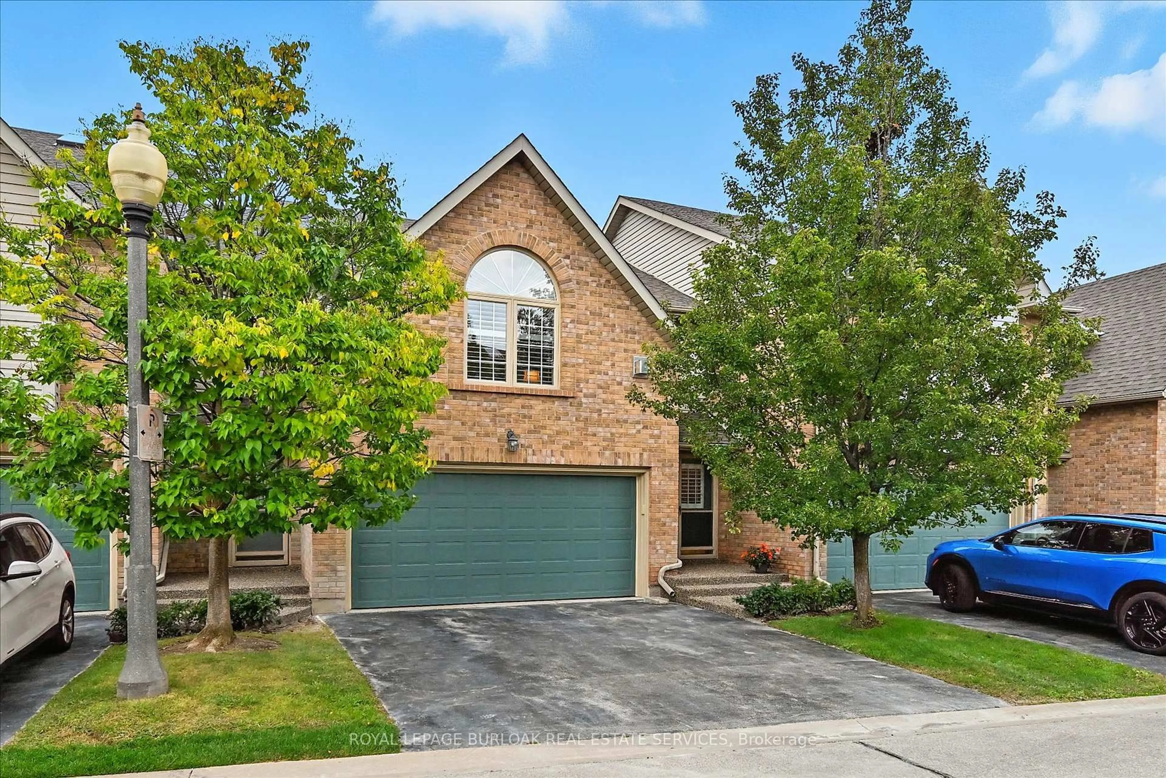 Home with brick exterior material, street for 3333 New St #18, Burlington Ontario L7N 1N1