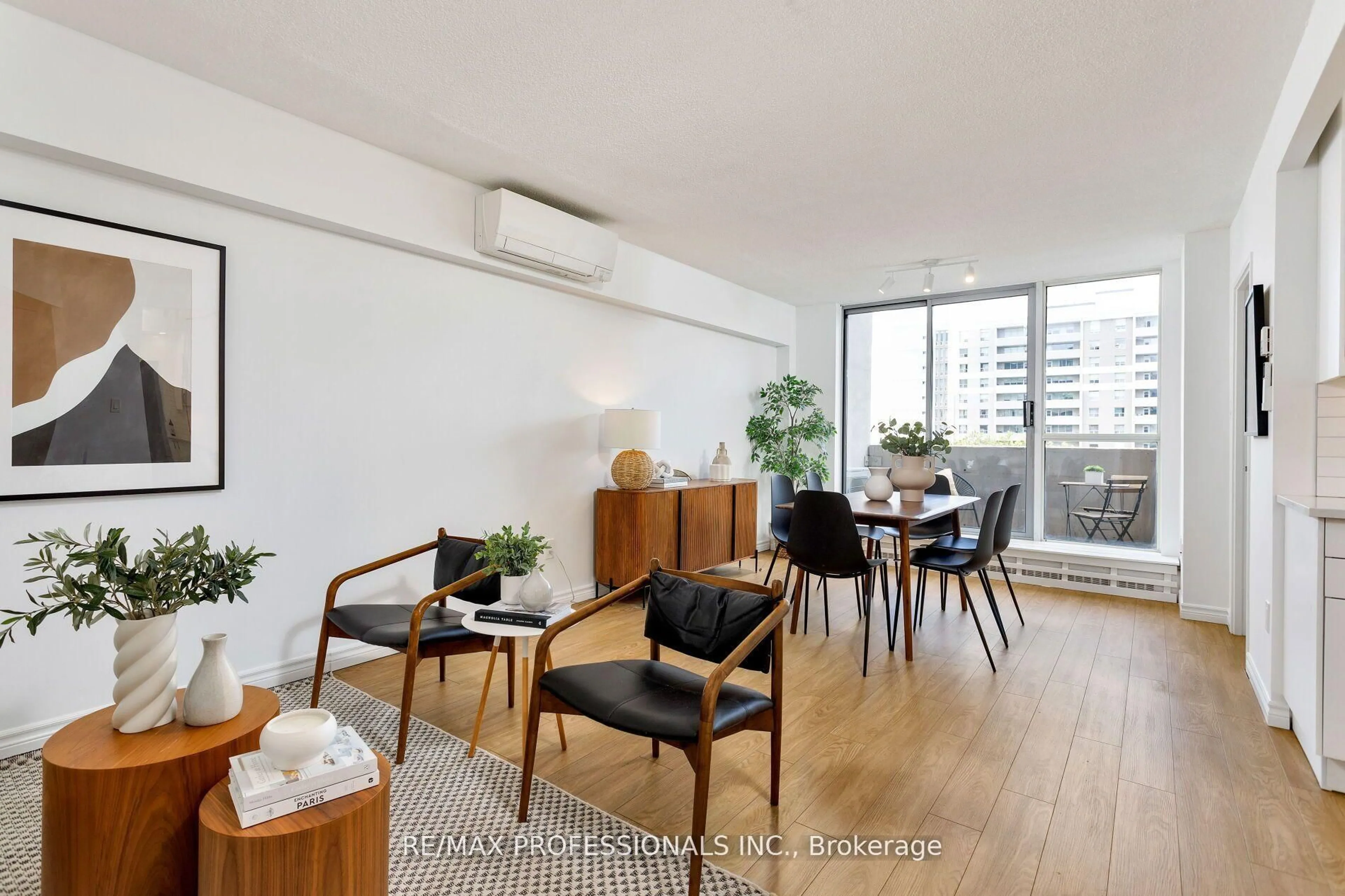Living room with furniture, wood/laminate floor for 35 Ormskirk Ave #510, Toronto Ontario M6S 1A8