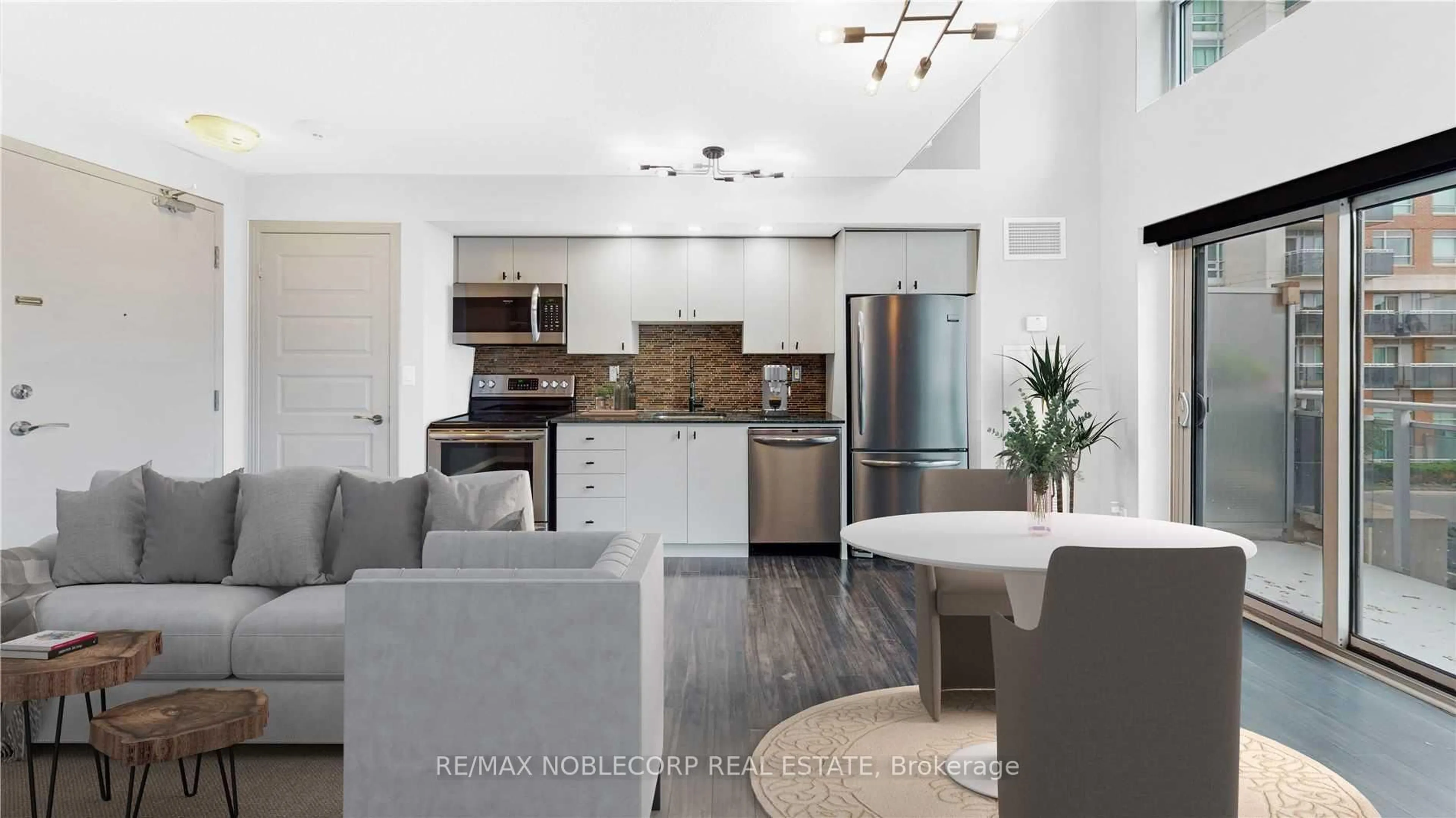 Open concept kitchen, ceramic/tile floor for 215 Queen St #212, Brampton Ontario L6W 0A9