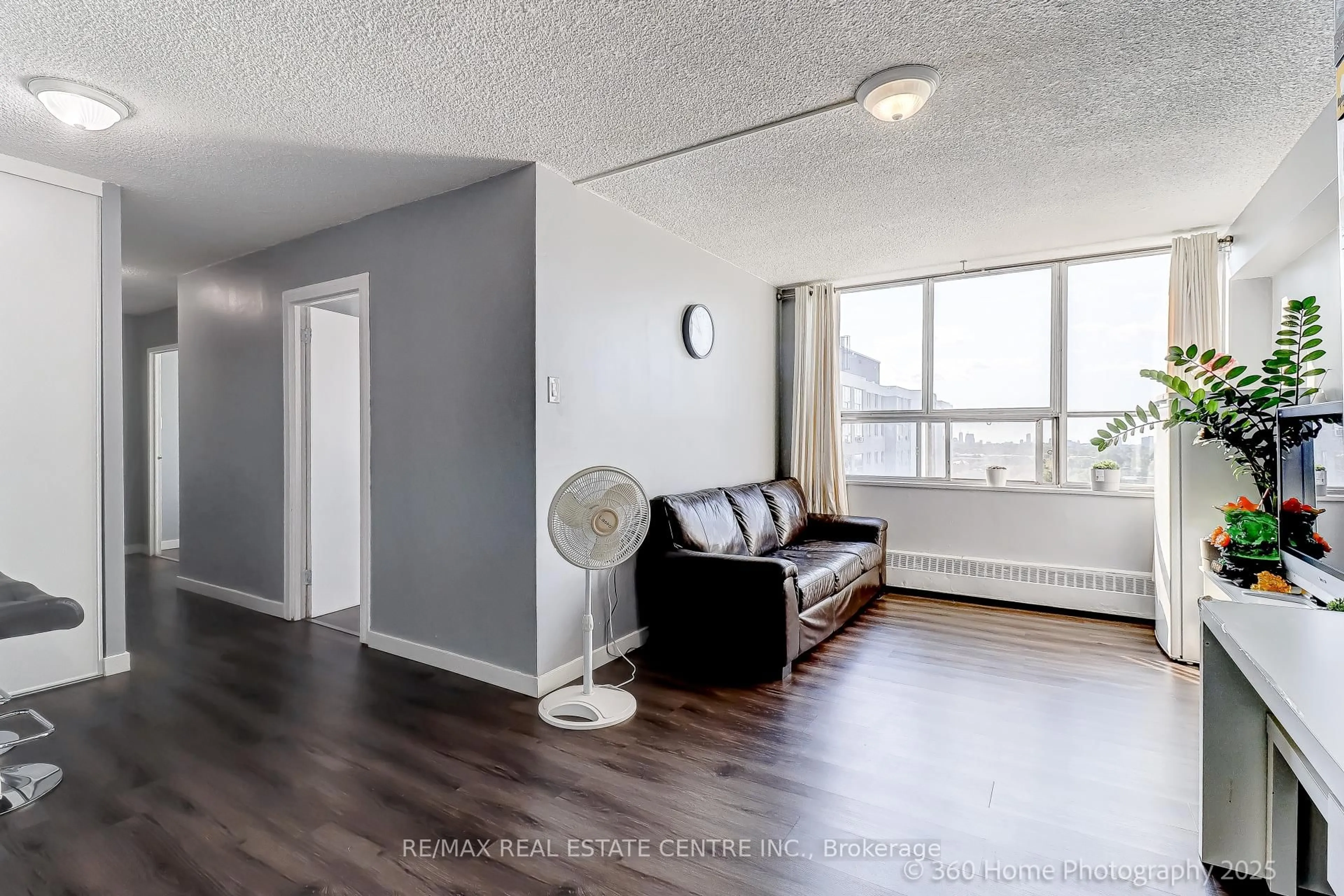 Living room with furniture, wood/laminate floor for 200 Lotherton Ptwy #1108, Toronto Ontario M6B 2G9