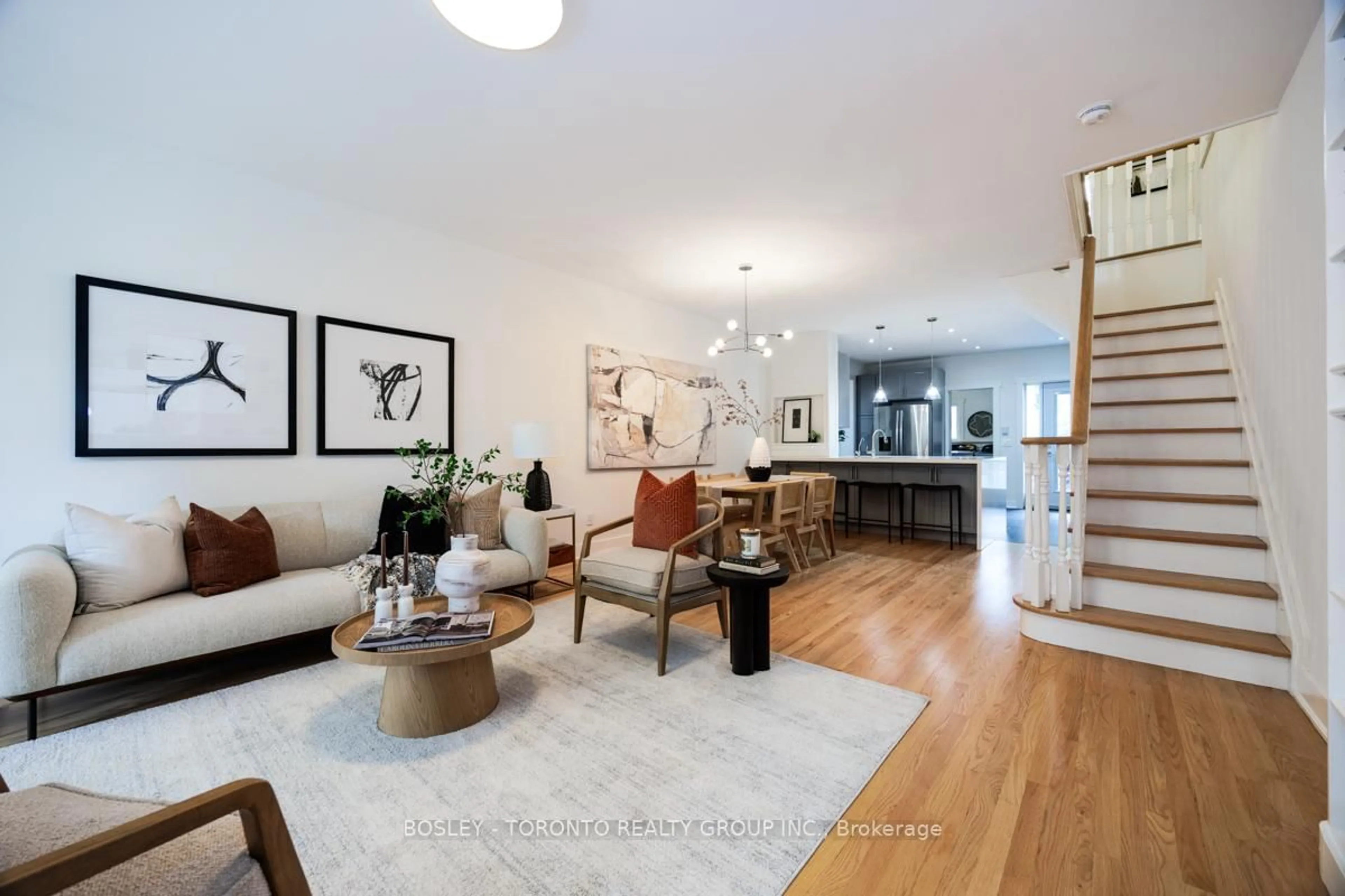 Living room with furniture, wood/laminate floor for 84 Geoffrey St, Toronto Ontario M6R 1P3