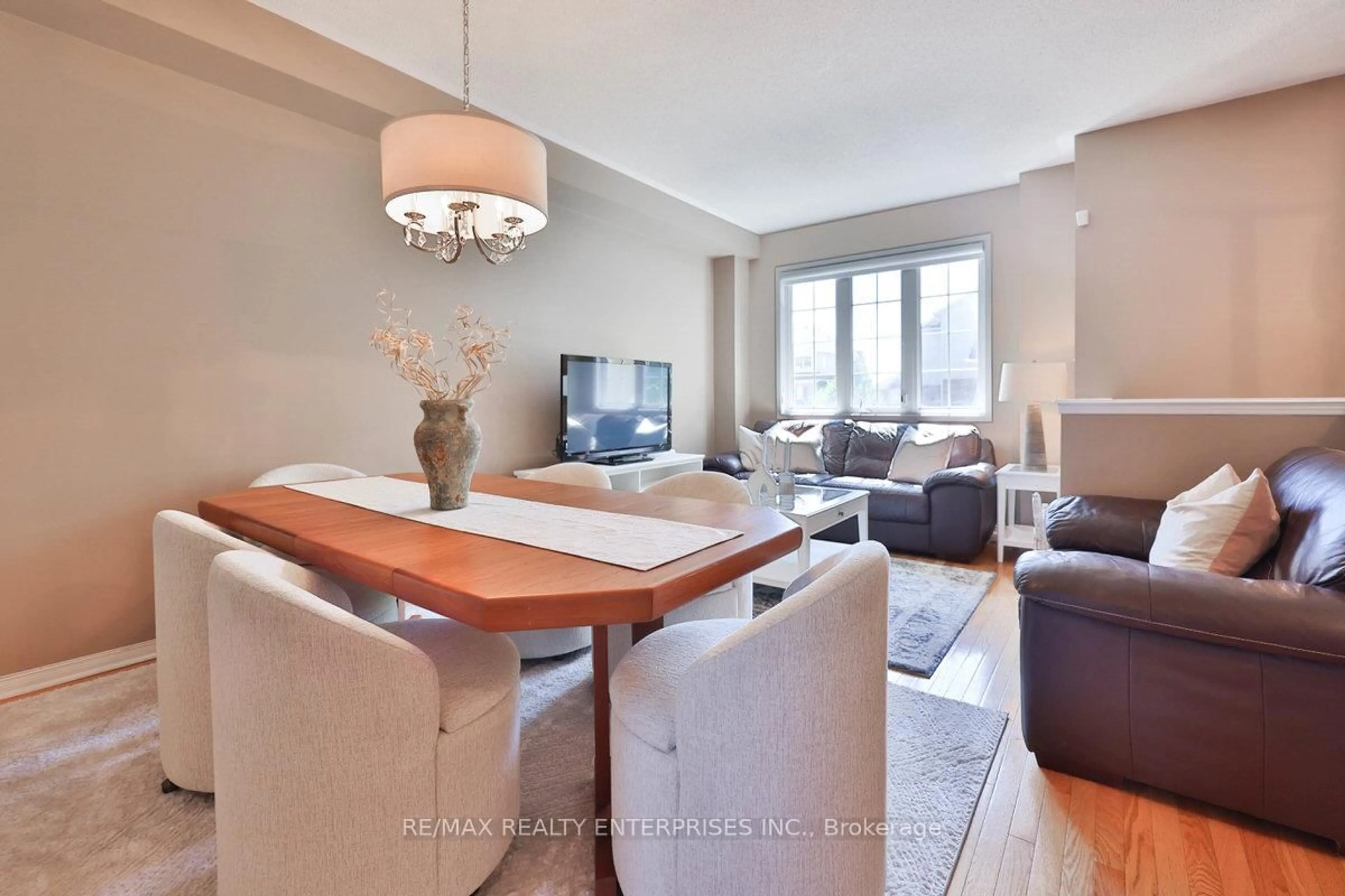 Living room with furniture, wood/laminate floor for 2171 Fiddlers Way #14, Oakville Ontario L6M 0R9