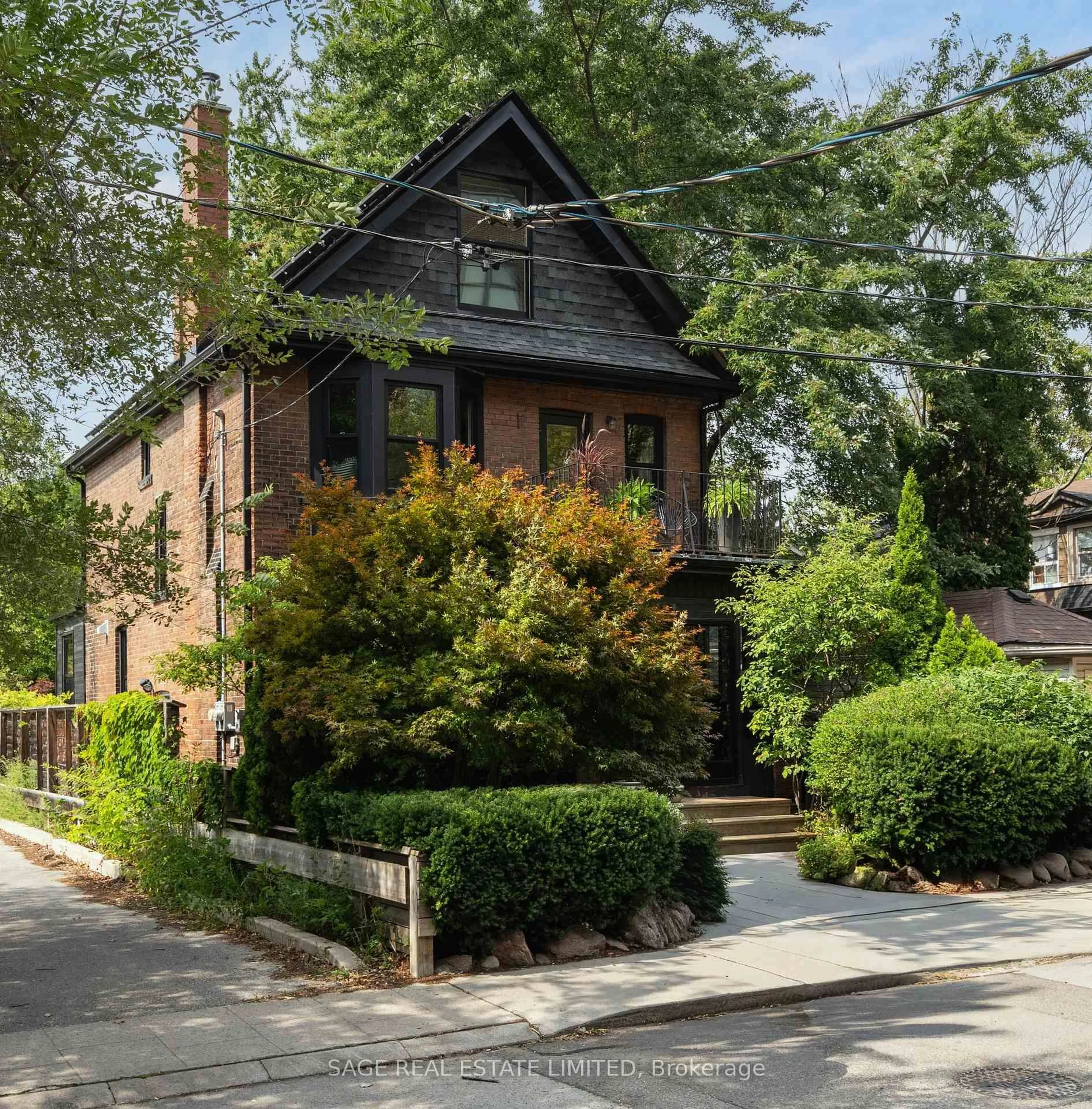 Home with brick exterior material, street for 322 Sorauren Ave, Toronto Ontario M6R 2G7