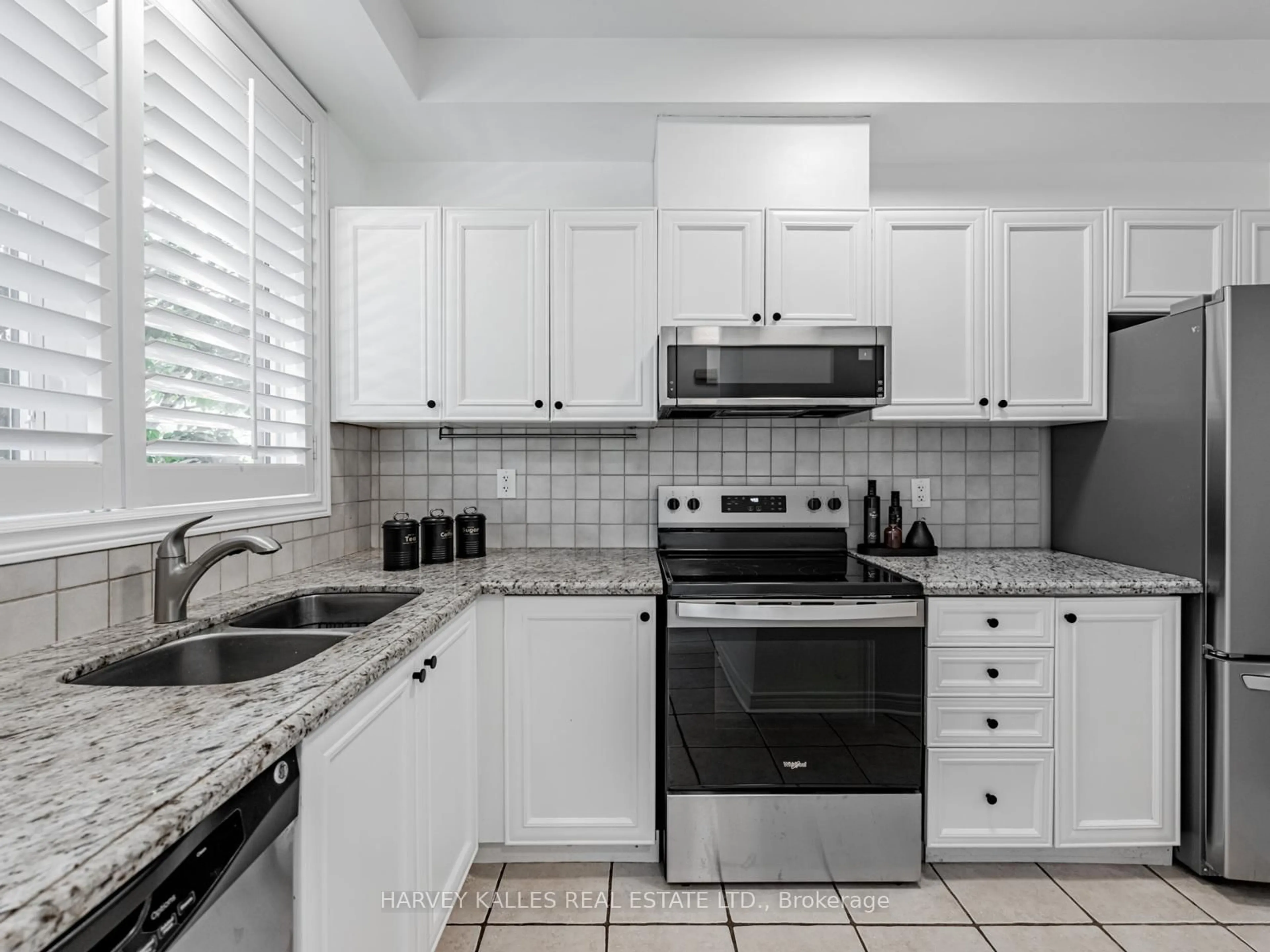 Standard kitchen, ceramic/tile floor for 52 Market Garden Mews, Toronto Ontario M8Z 0A5