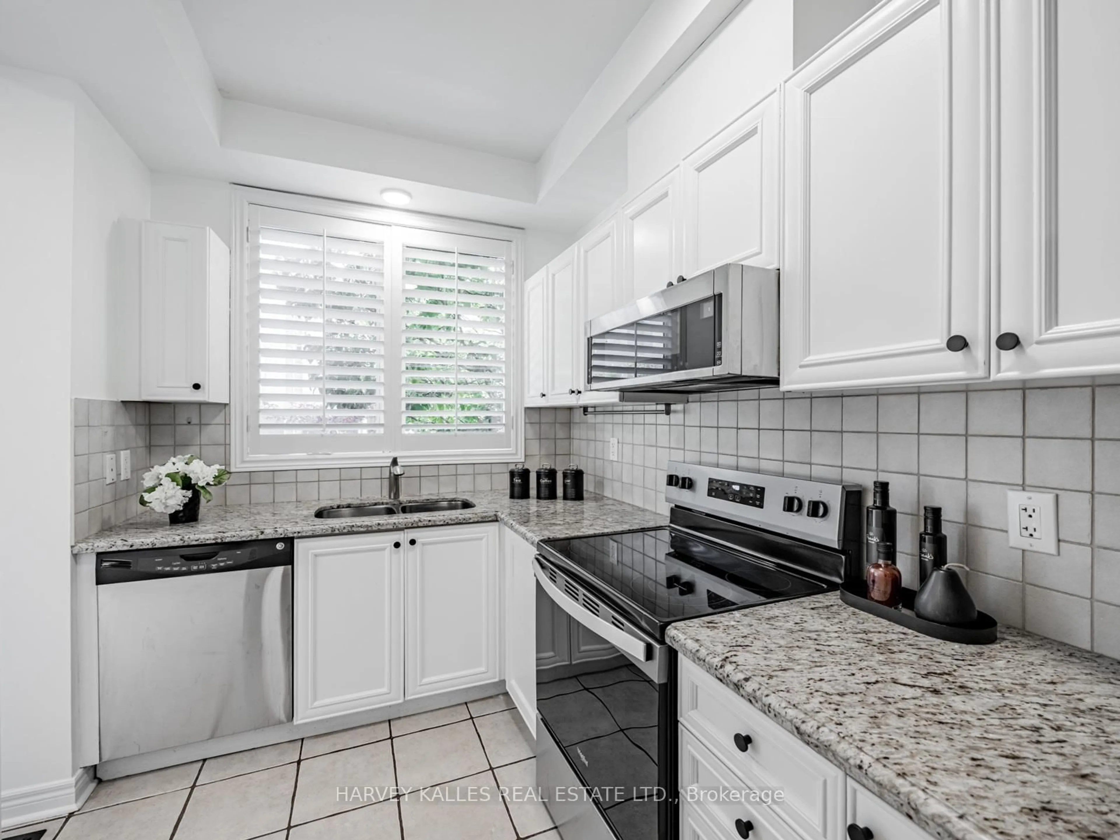 Standard kitchen, ceramic/tile floor for 52 Market Garden Mews, Toronto Ontario M8Z 0A5