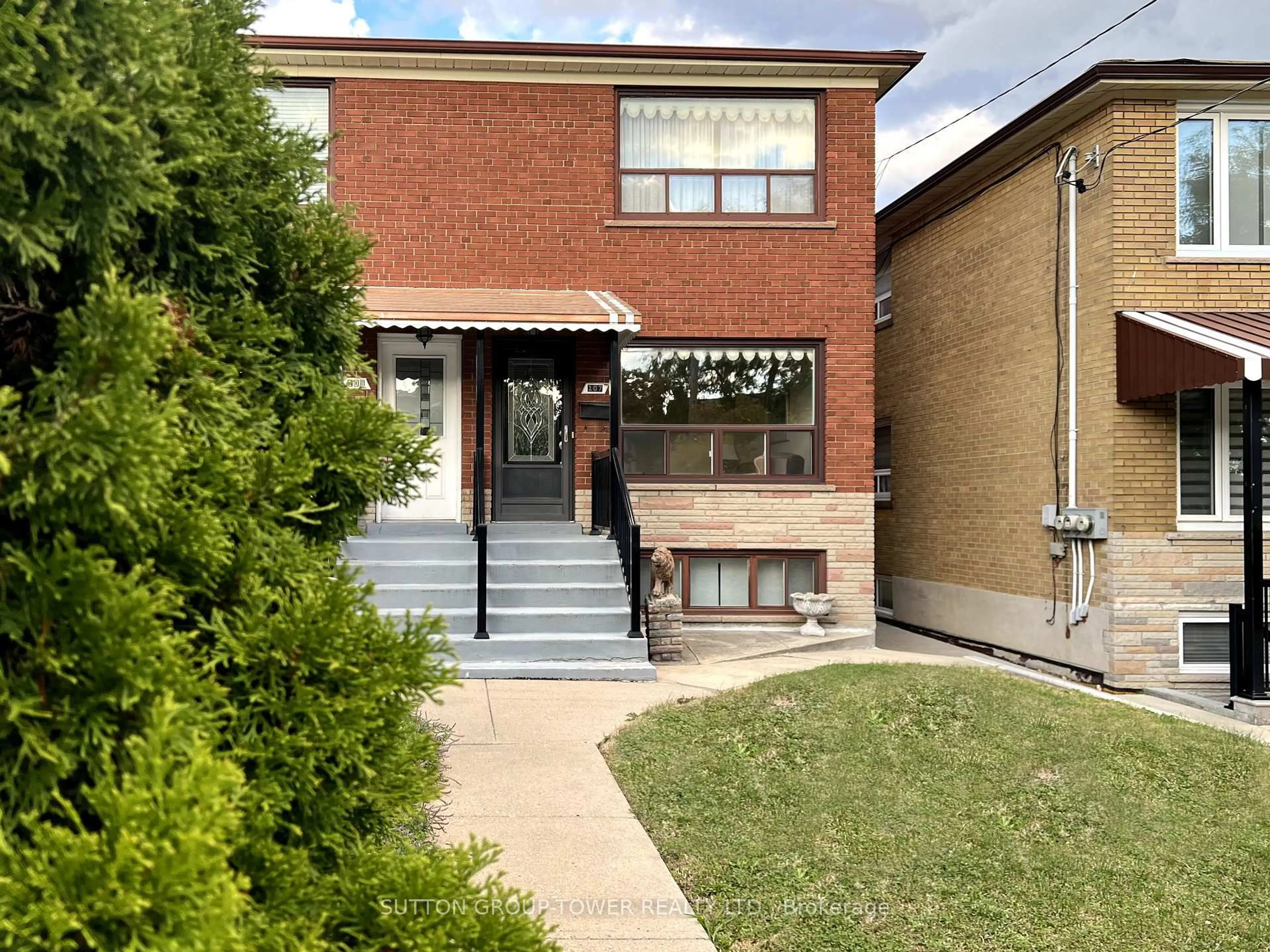 Home with brick exterior material, street for 107 Caledonia Rd, Toronto Ontario M6E 4S8