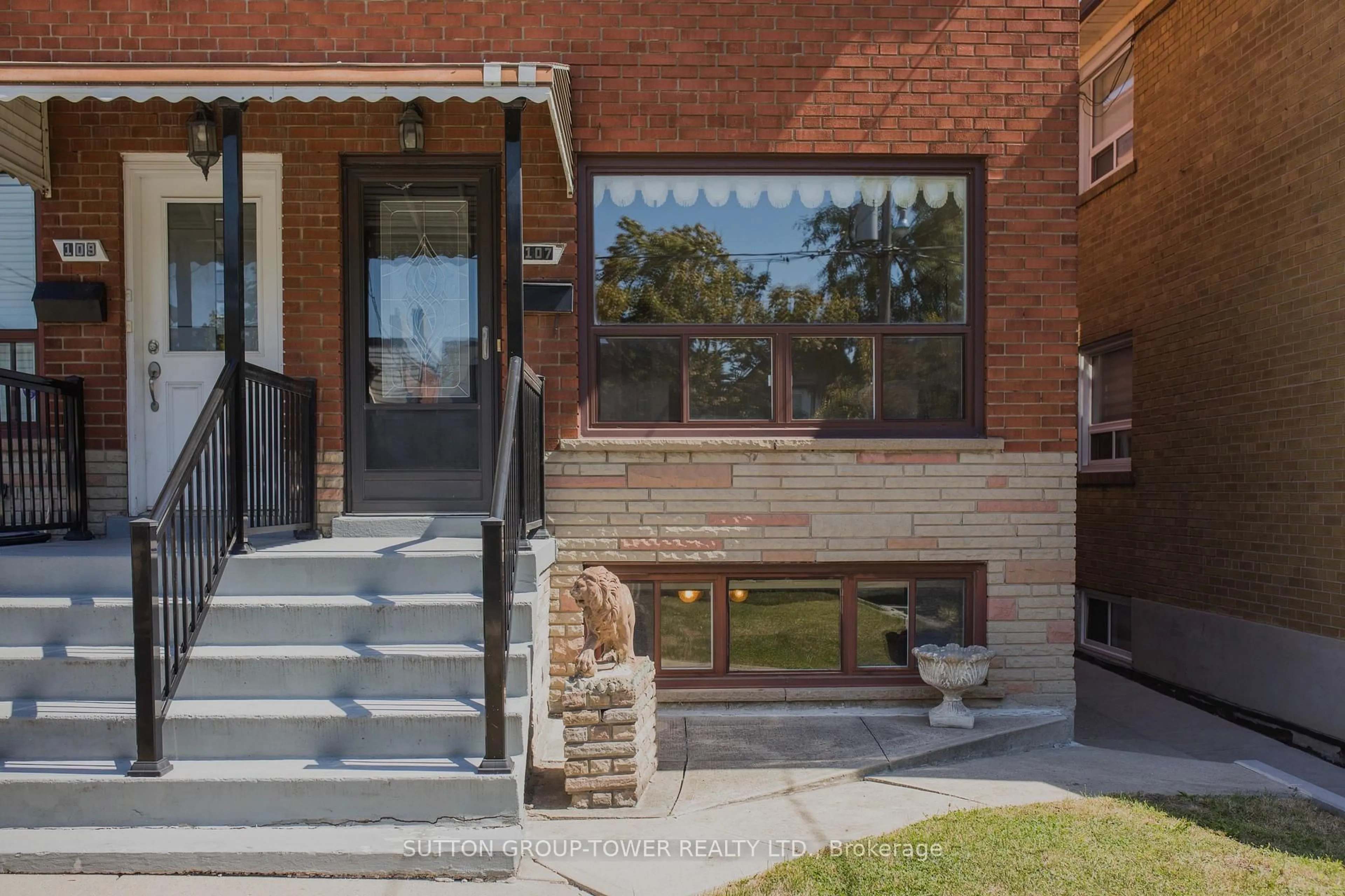 Home with brick exterior material, street for 107 Caledonia Rd, Toronto Ontario M6E 4S8