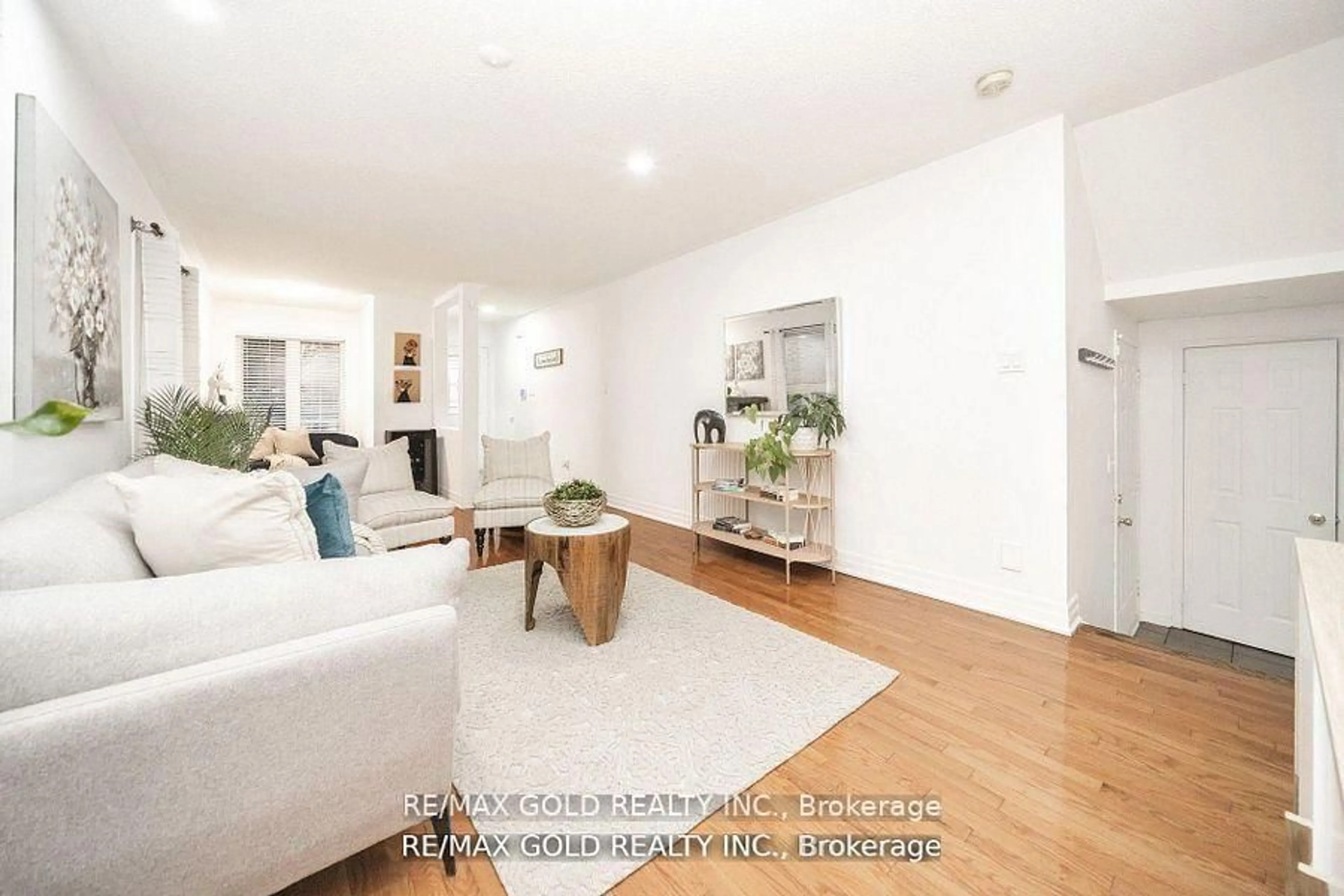 Living room with furniture, wood/laminate floor for 36 Roxton Cres, Brampton Ontario L7A 2A9