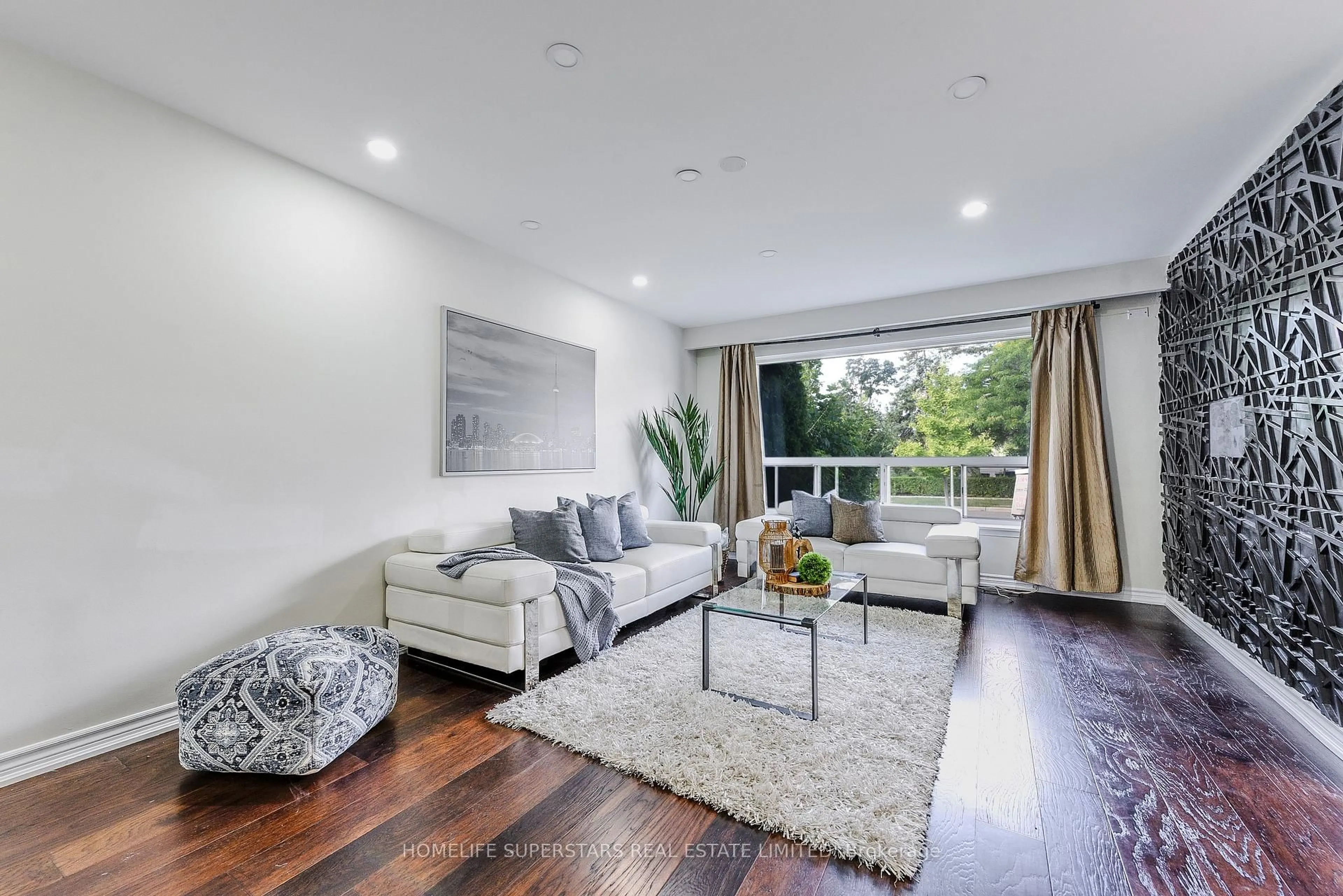 Living room with furniture, wood/laminate floor for 3 Lightwood Dr, Toronto Ontario M9V 2Z1