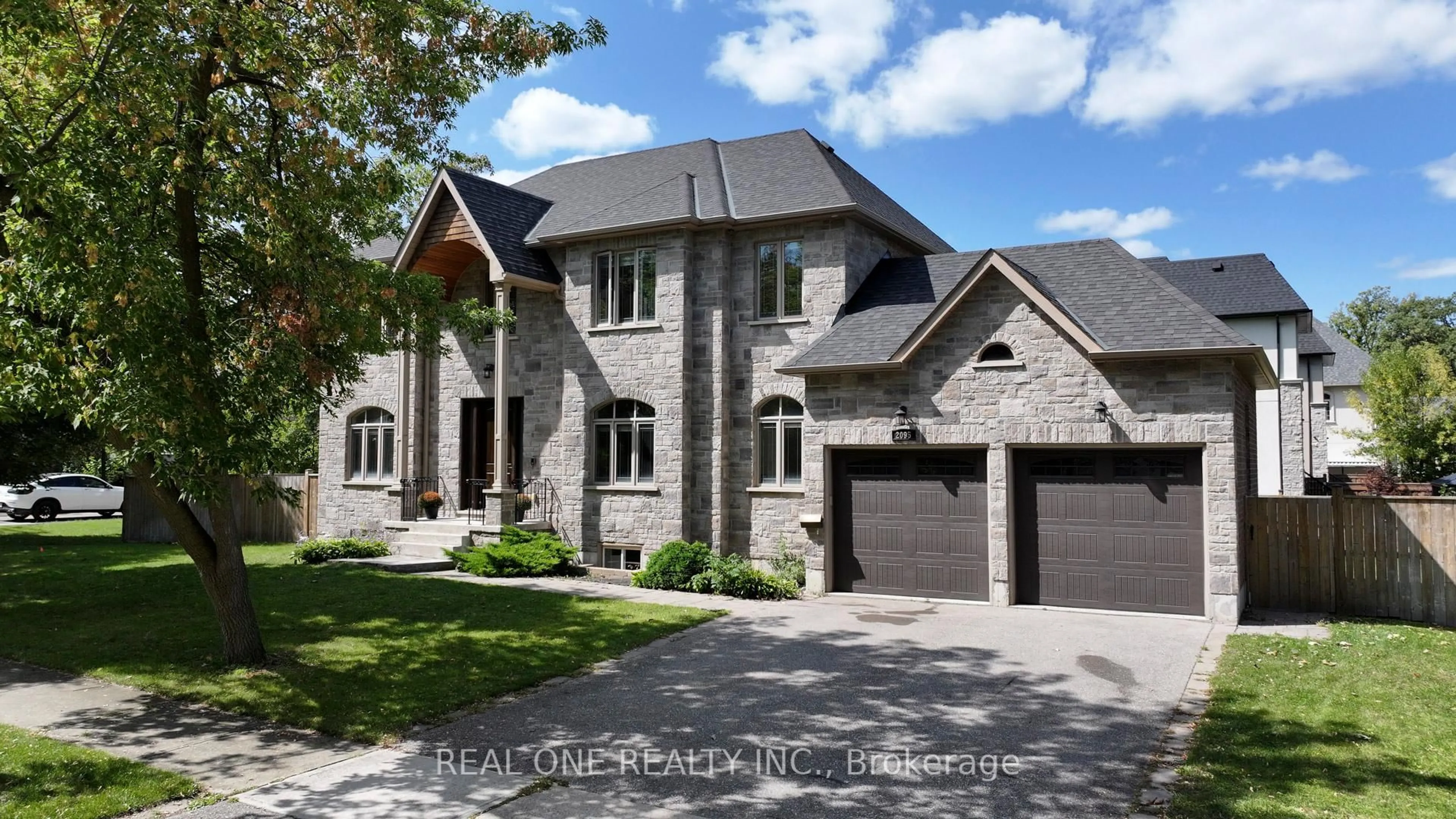 Home with brick exterior material, street for 2095 Springfield Rd, Mississauga Ontario L5K 1C1