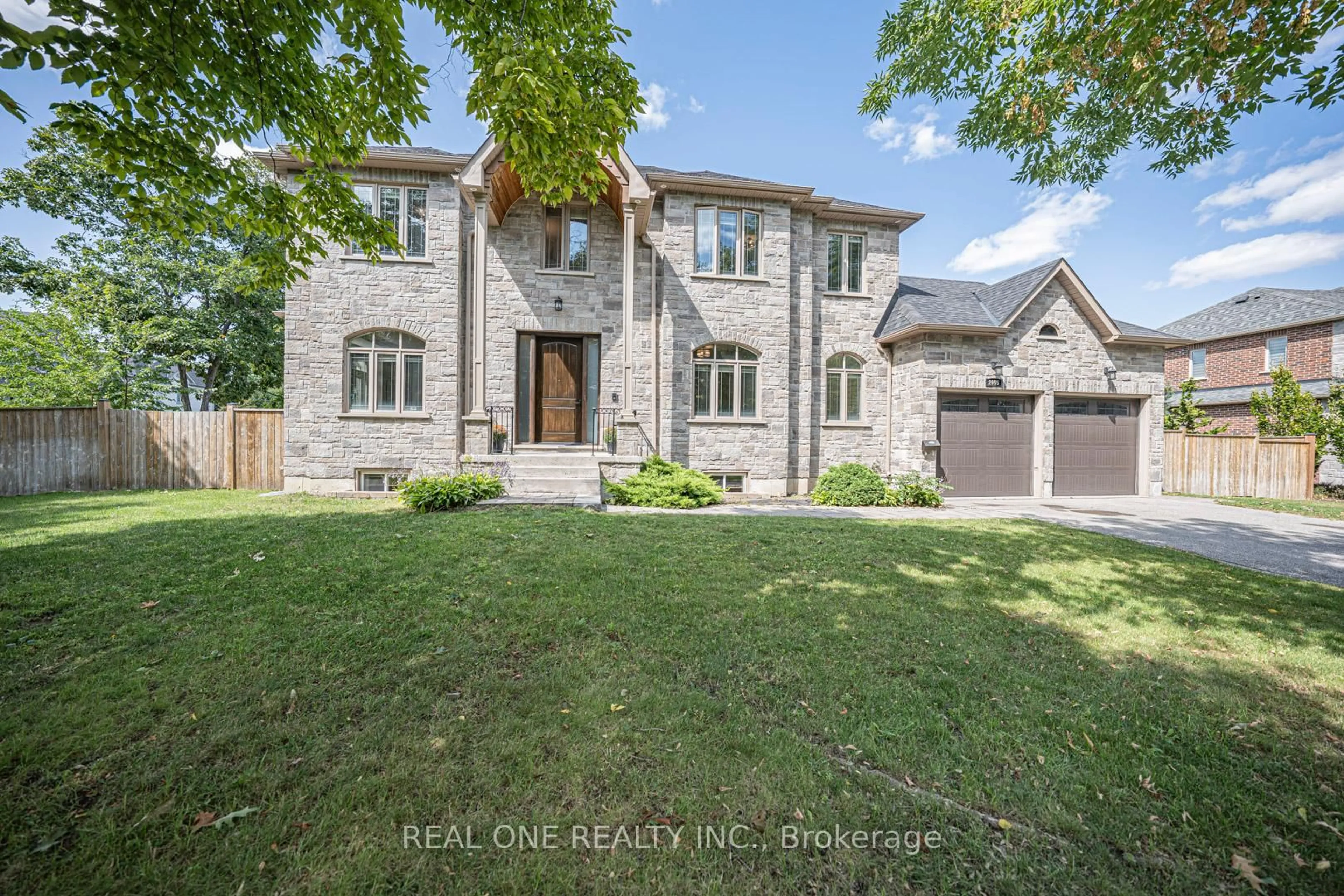 Home with brick exterior material, street for 2095 Springfield Rd, Mississauga Ontario L5K 1C1