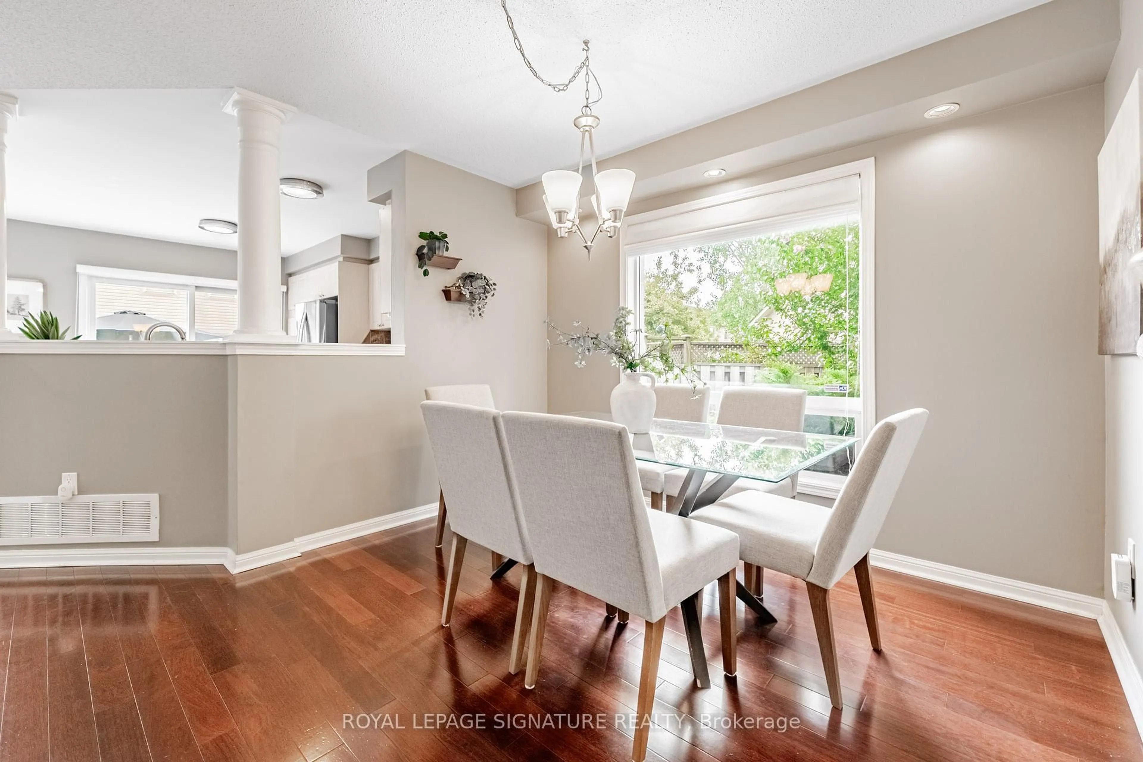 Dining room, wood/laminate floor for 402 Baverstockstock Cres, Milton Ontario L9T 5L1