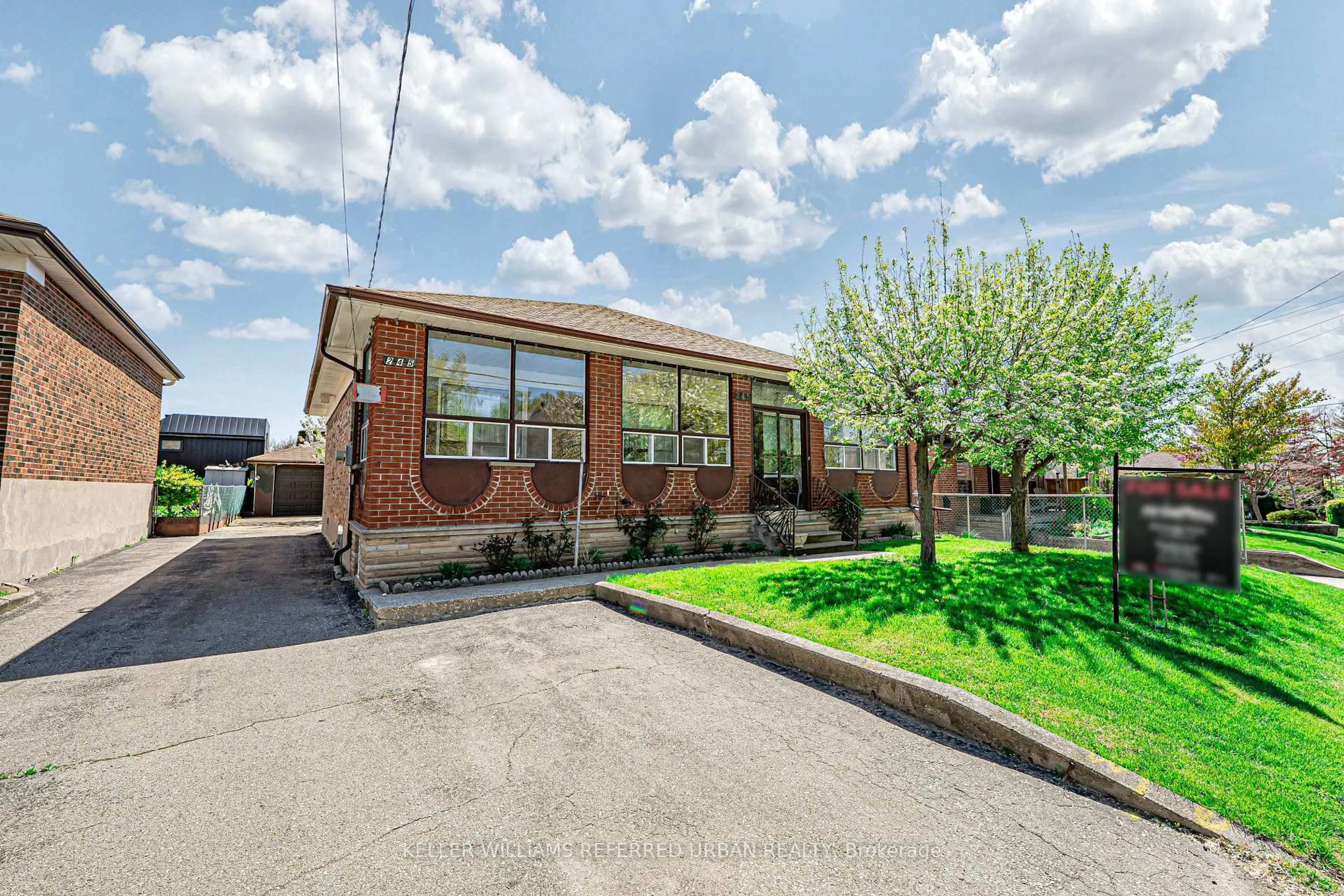 Home with brick exterior material, street for 245 Falstaff Ave, Toronto Ontario M6L 2G3