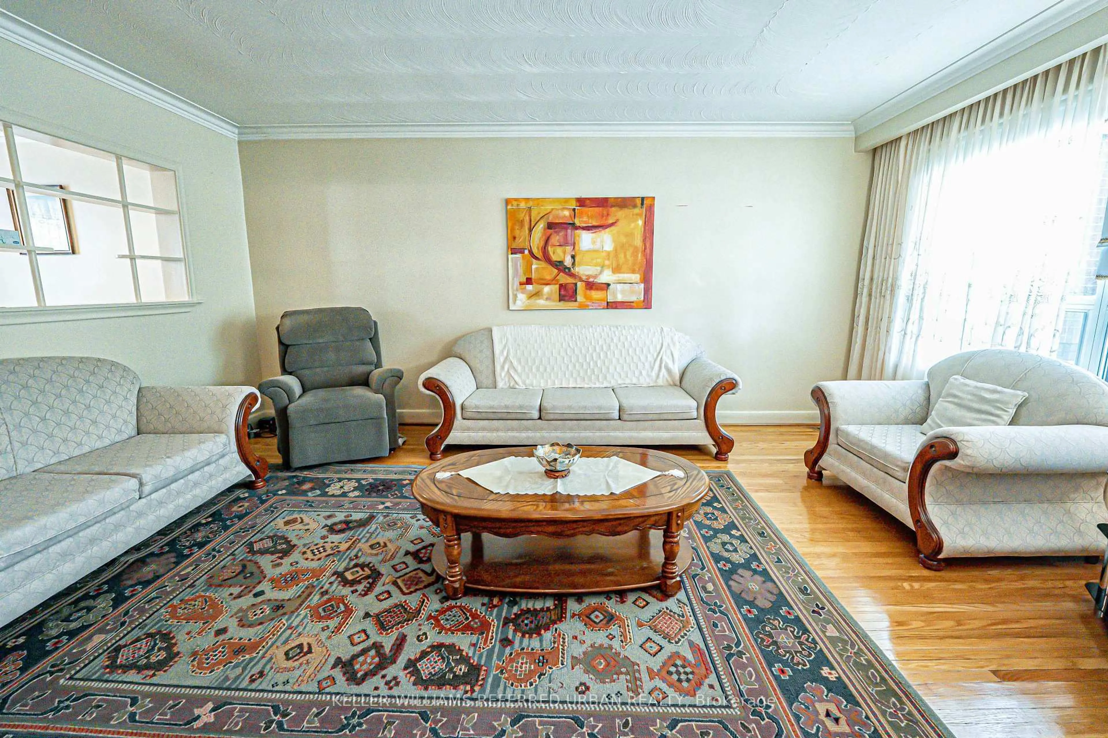 Living room with furniture, unknown for 245 Falstaff Ave, Toronto Ontario M6L 2G3