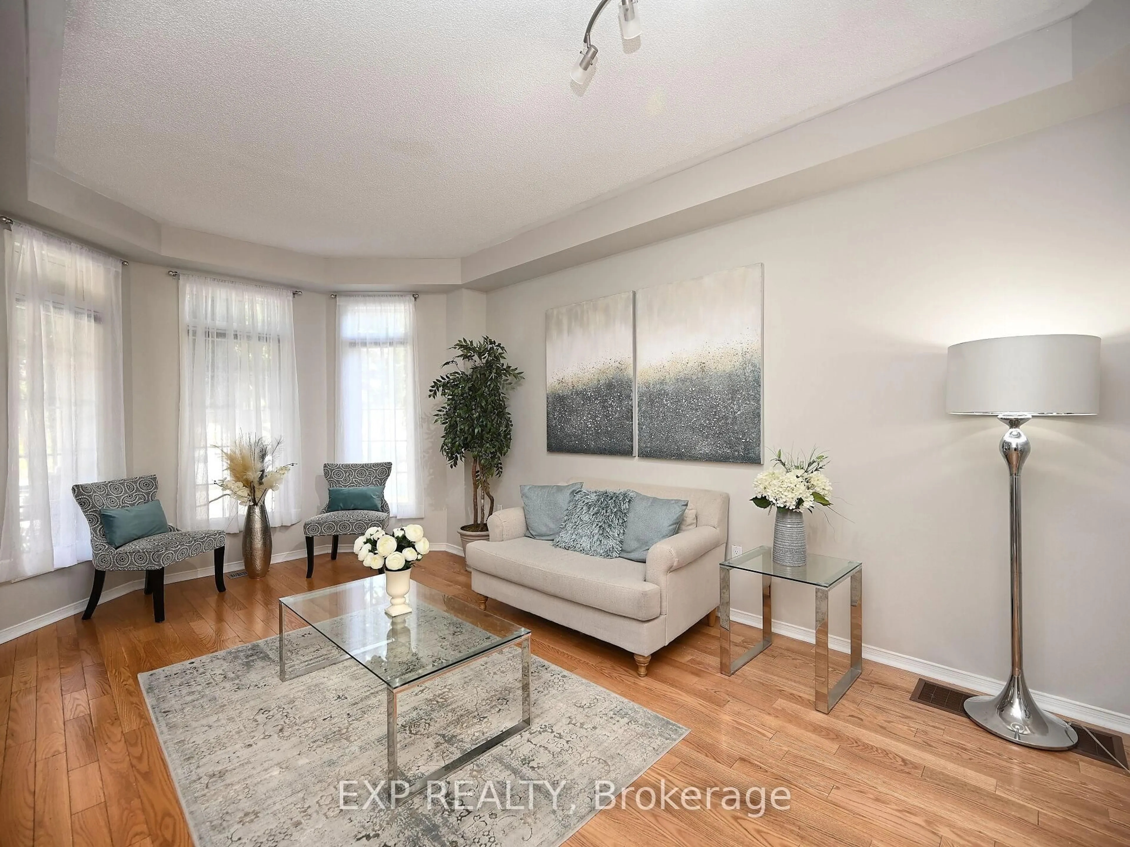 Living room with furniture, wood/laminate floor for 140 GATWICK Dr, Oakville Ontario L6H 6N3
